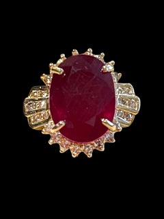 Oval 12 Carat Treated Ruby and 1 Carat Diamond 14 Karat Yellow Gold Ring