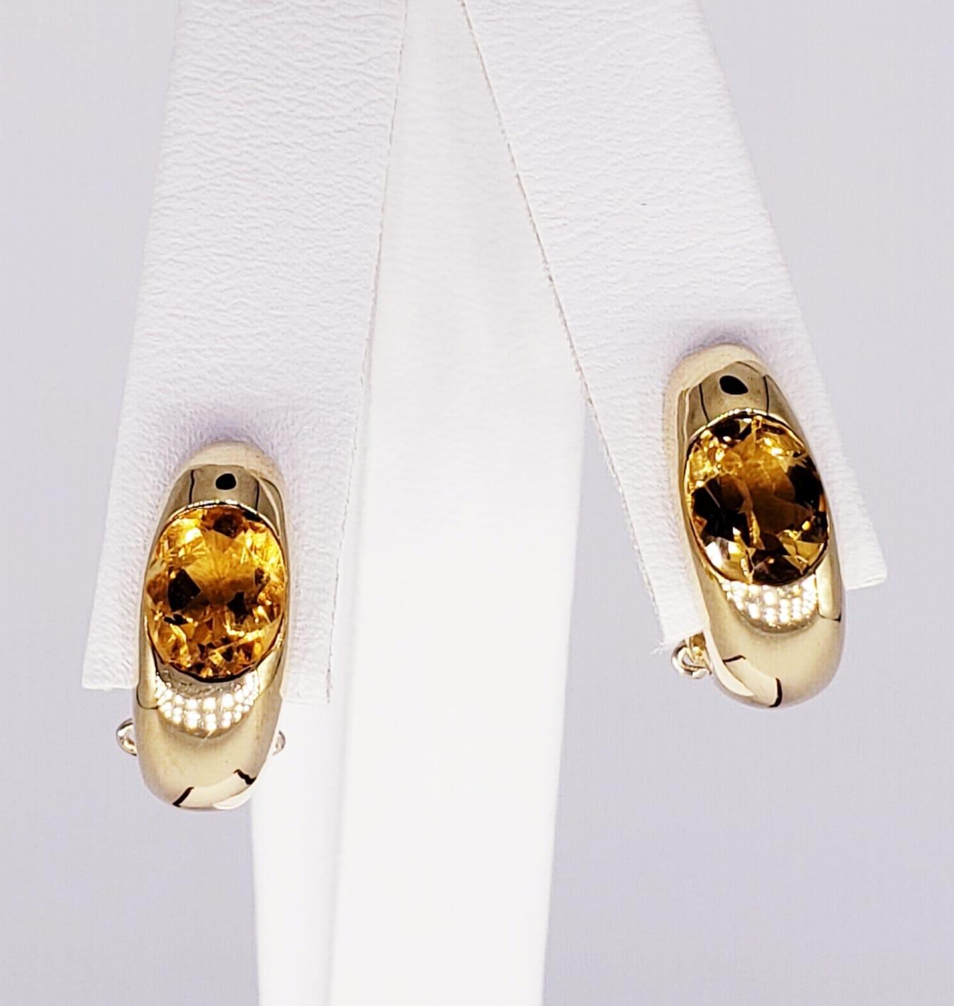 Oval 1.21 Carat Citrine Gem 18k Gold Earrings. The earrings measure 6.80mm X 16.70mm. The total carat weight of the citrine gems are approx 1.21 carats. Beautiful clip back classic design earrings by Italian designer stamped 1360 VI & 750 for gold