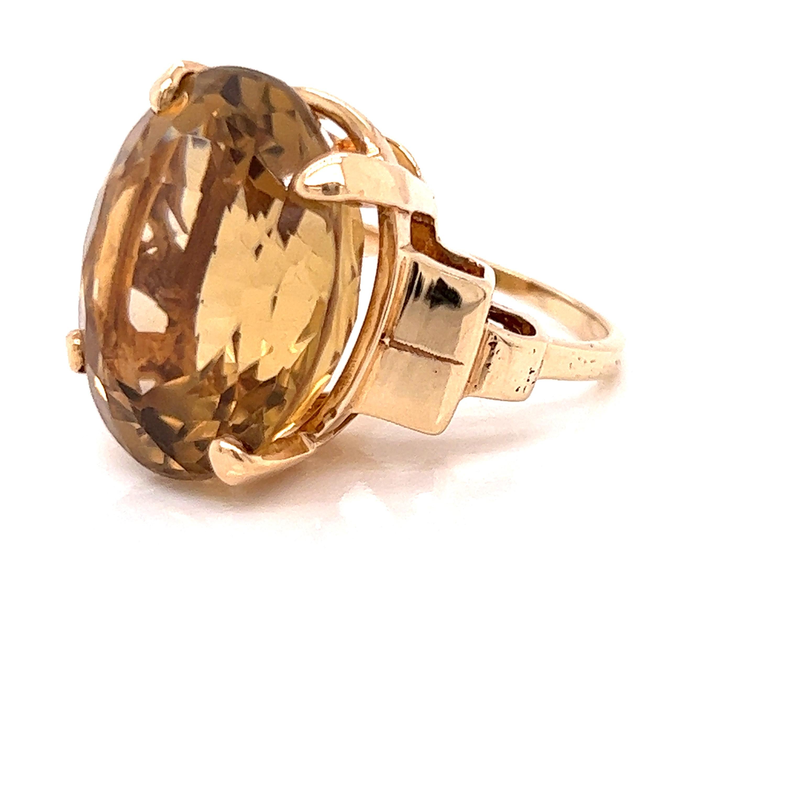 November Birthdays and statement ring fans will enjoy this vintage 17.09 carat oval citrine ring.  Set in five grams of 14K yellow gold, this is a substantial piece of jewelry.  This is a US size 6.25 and can be sized.
This ring is estate in very