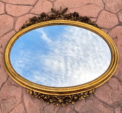 Oval 1940s Wall Mirror With Gold Frame And Floral Decoration In Louis XVI Style