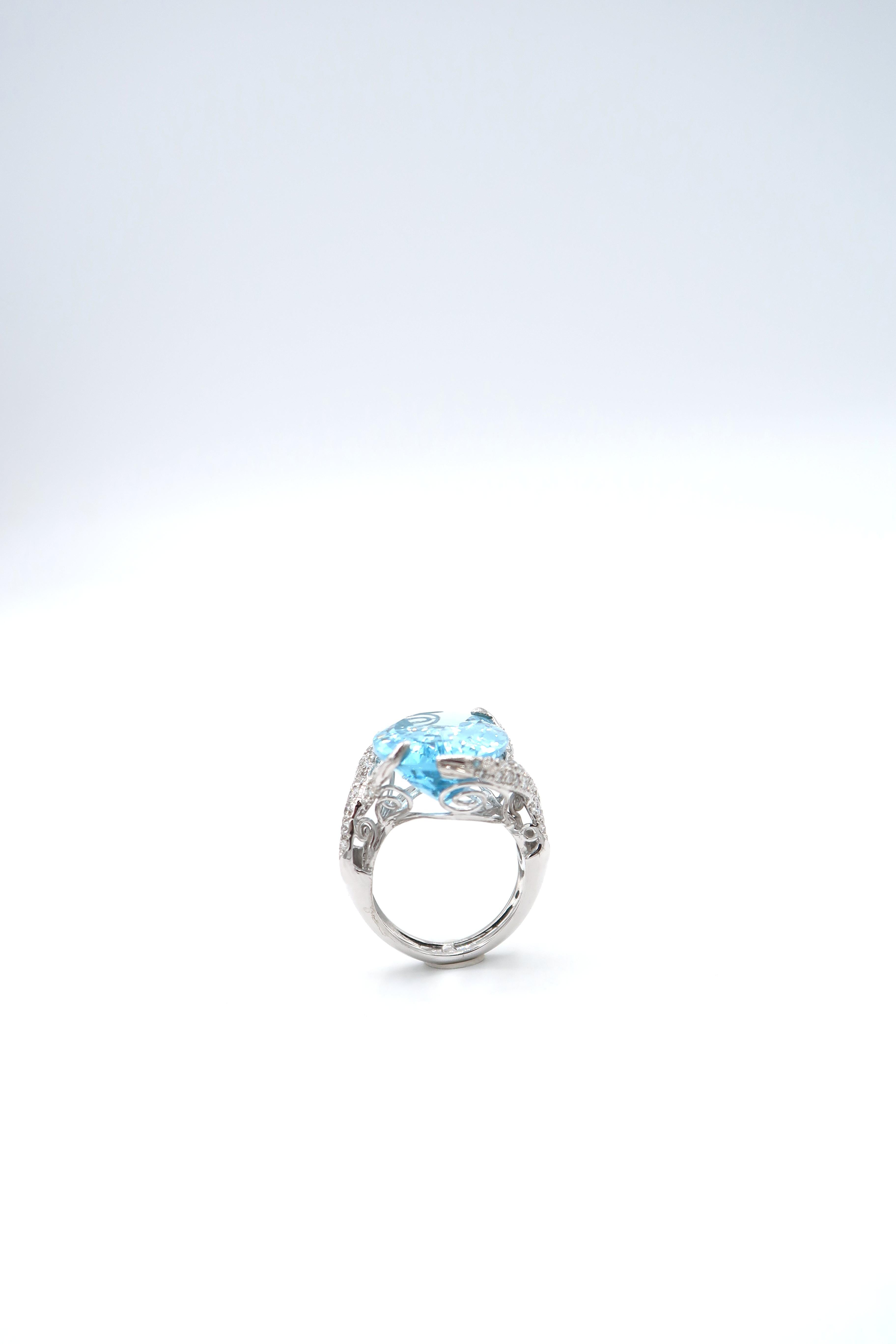 Contemporary 19.94 Carat Oval Blue Topaz Pavé Diamond Swirl 18K White Gold Ring For Sale