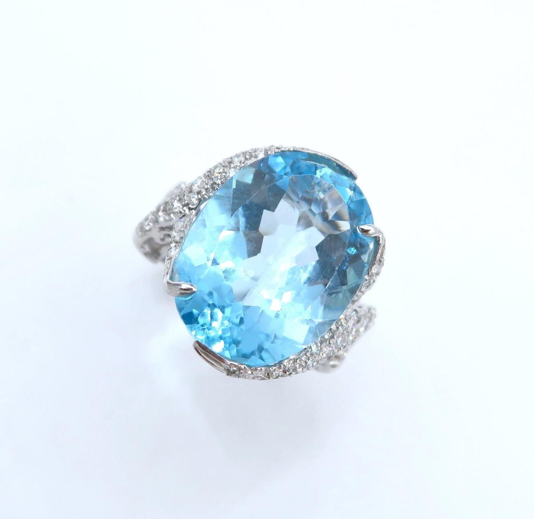 Oval Cut 19.94 Carat Oval Blue Topaz Pavé Diamond Swirl 18K White Gold Ring For Sale