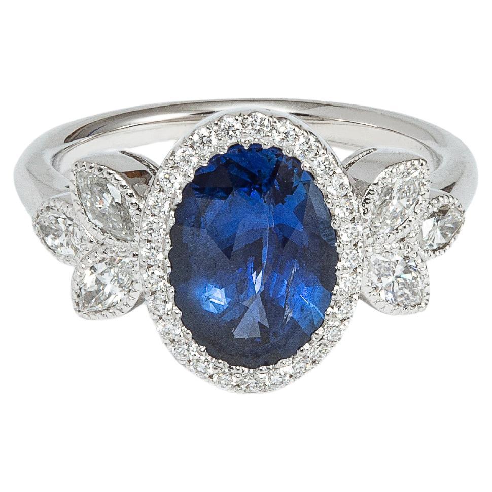 Oval 3.16 Carats Deep Blue Ceylon Sapphire and Diamond Ring For Sale