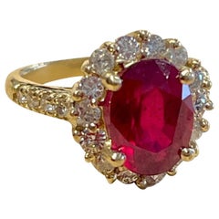 Oval 4.5 Carat Treated Ruby and 1.25 Carat Diamond 14 Karat Yellow Gold Ring