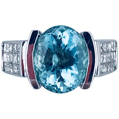 Oval 5.00 Carat Paraiba, 18 Karat, 1.05 Carat V.S Quality Princess Diamonds