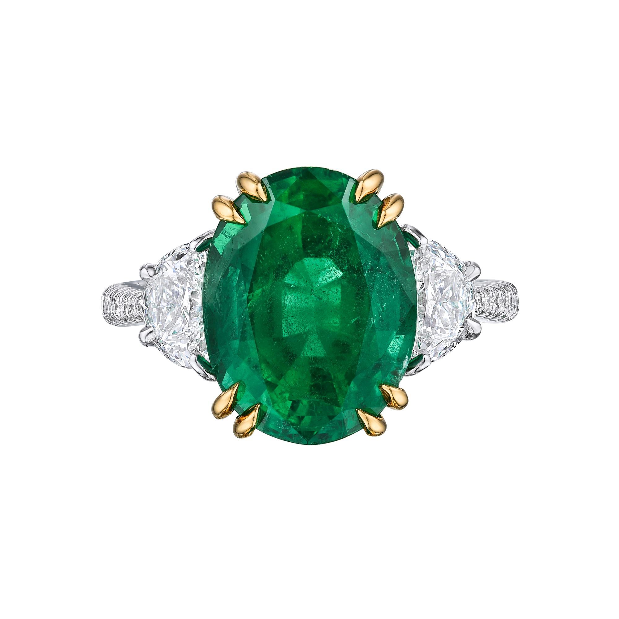 Oval Green Emerald Cocktail Ring set in Platinum with 18K yellow gold prongs. 5.72 Intense green Emerald stone set in platinum with half moon and brilliant round cut diamonds. Center stone is 5.72 carats, side stones: 1.20 carats F-G Vs1_Vs2. Total