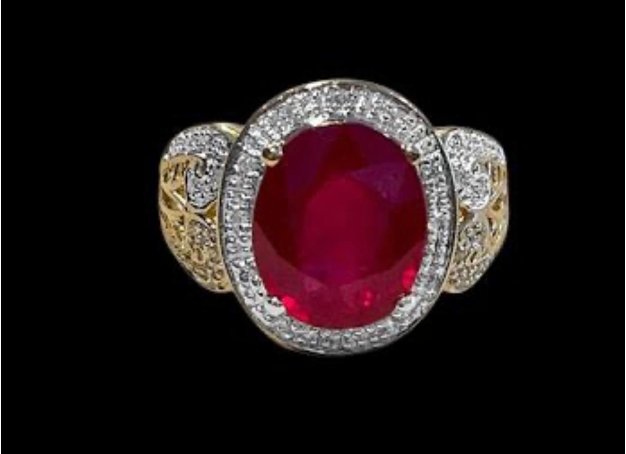 12x10 Oval Cut   Approximately 7.5  Carat Treated Ruby  14  Karat Yellow Gold Ring Size 8
Diamond Brilliant cut approximately 1 ct , 
Its a treated ruby prong set
14 Karat Yellow Gold: 7.3  gram with stone
Ring Size 8 ( can be altered for no charge