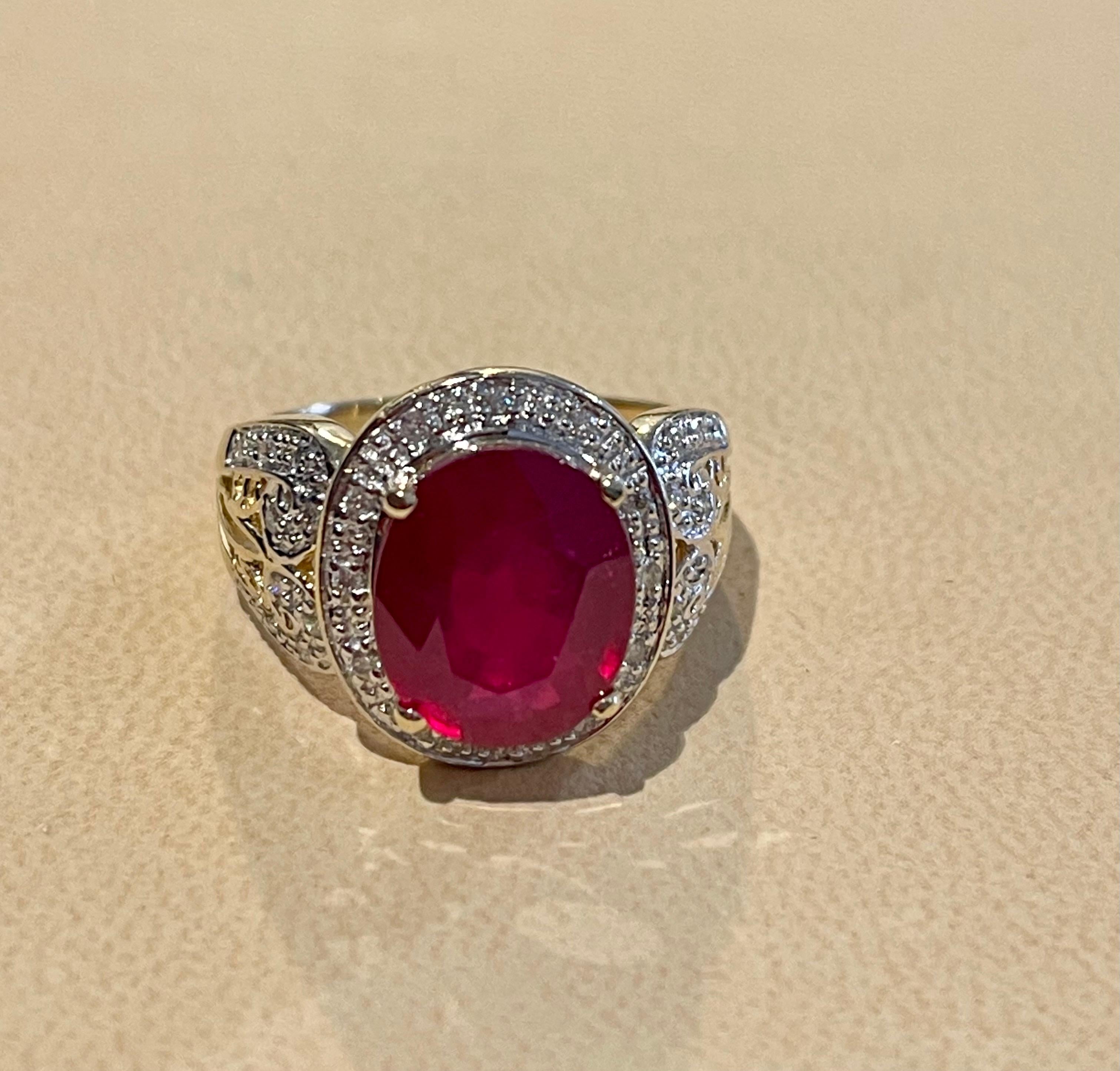 Oval Cut Oval 7.5 Carat Treated Ruby and 1 Carat Diamond 14 Karat Yellow Gold Ring For Sale