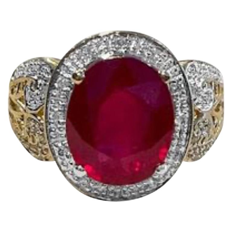 Oval 7.5 Carat Treated Ruby and 1 Carat Diamond 14 Karat Yellow Gold Ring For Sale