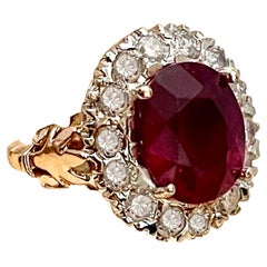 Oval 8 Carat Treated Ruby and 1 Carat Diamond 14 Karat Two Tone Gold Ring