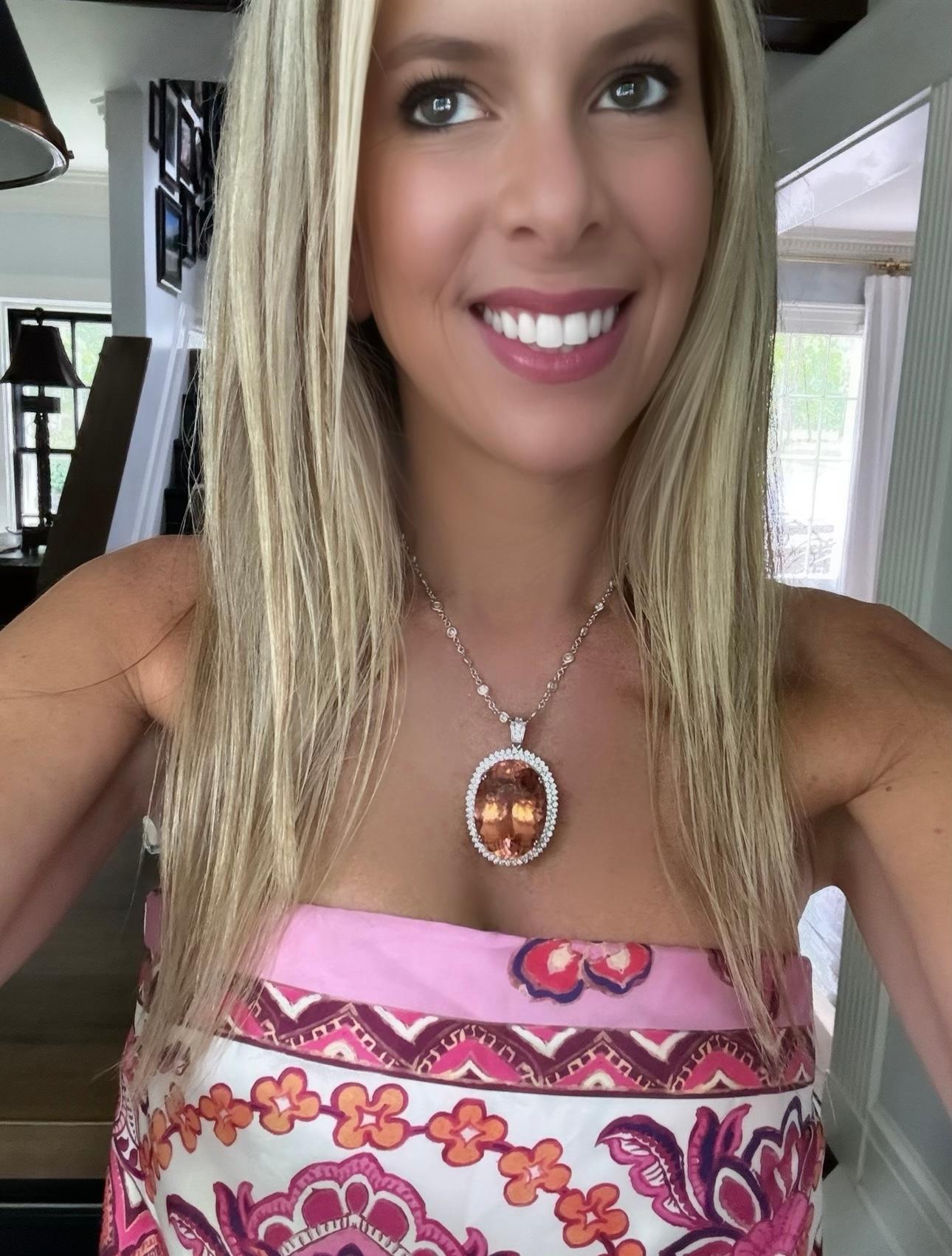 Indulge in luxury with our Fine Oval Morganite Pendant. This show stopping piece features a stunning 97.00 carat morganite gemstone.  Morganite is orange or pink, rare and durable. It is named after financier J.P. Morgan, associated with love,