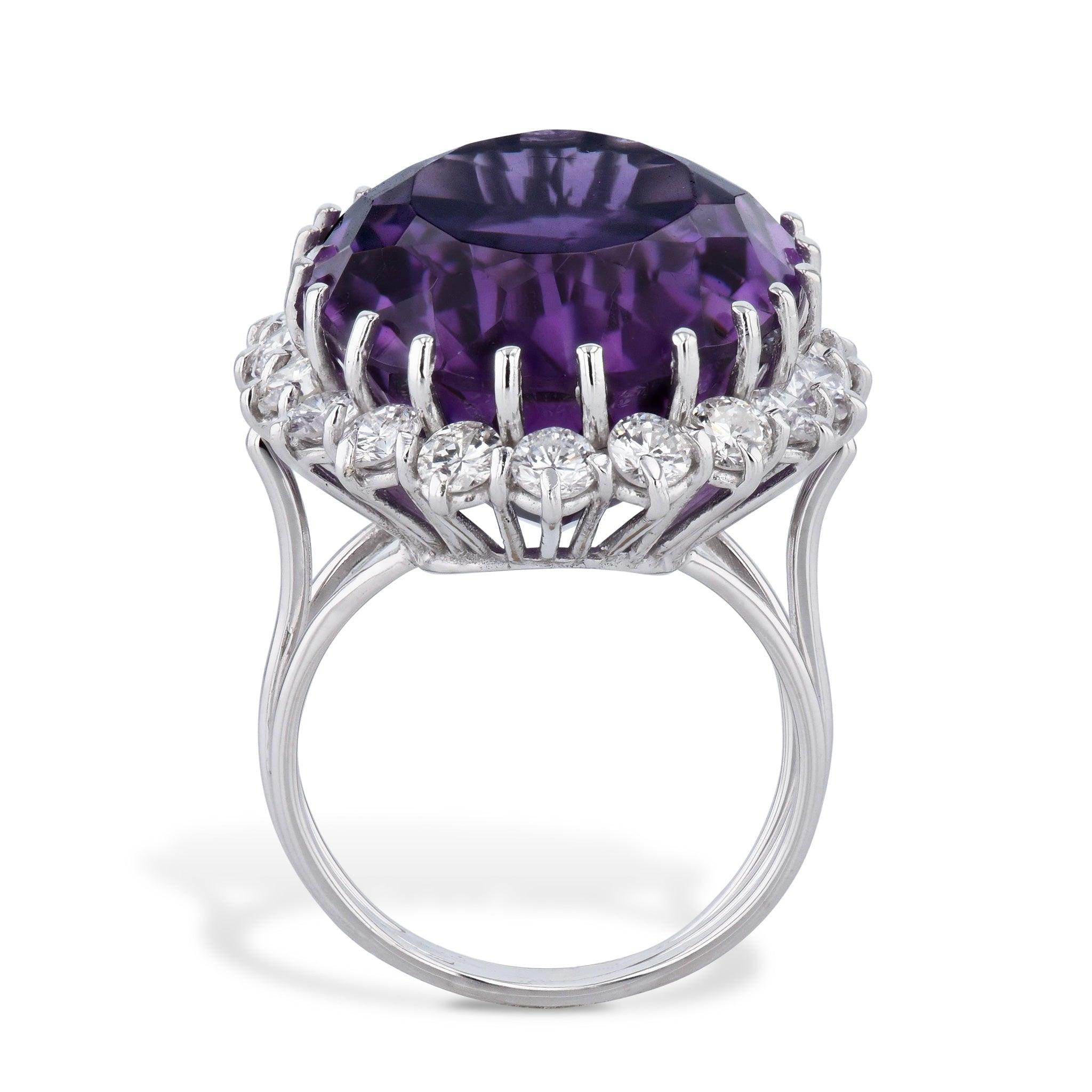 Gorgeous 14kt White Gold Oval Amethyst and Diamond Estate Ring from the H&H Estate Collection! Oval Amethyst measures 21.55mm x 16.35mm x 11.06mm and is set with 20 glimmering diamonds. An elegant size 5.5 ring befitting of any special