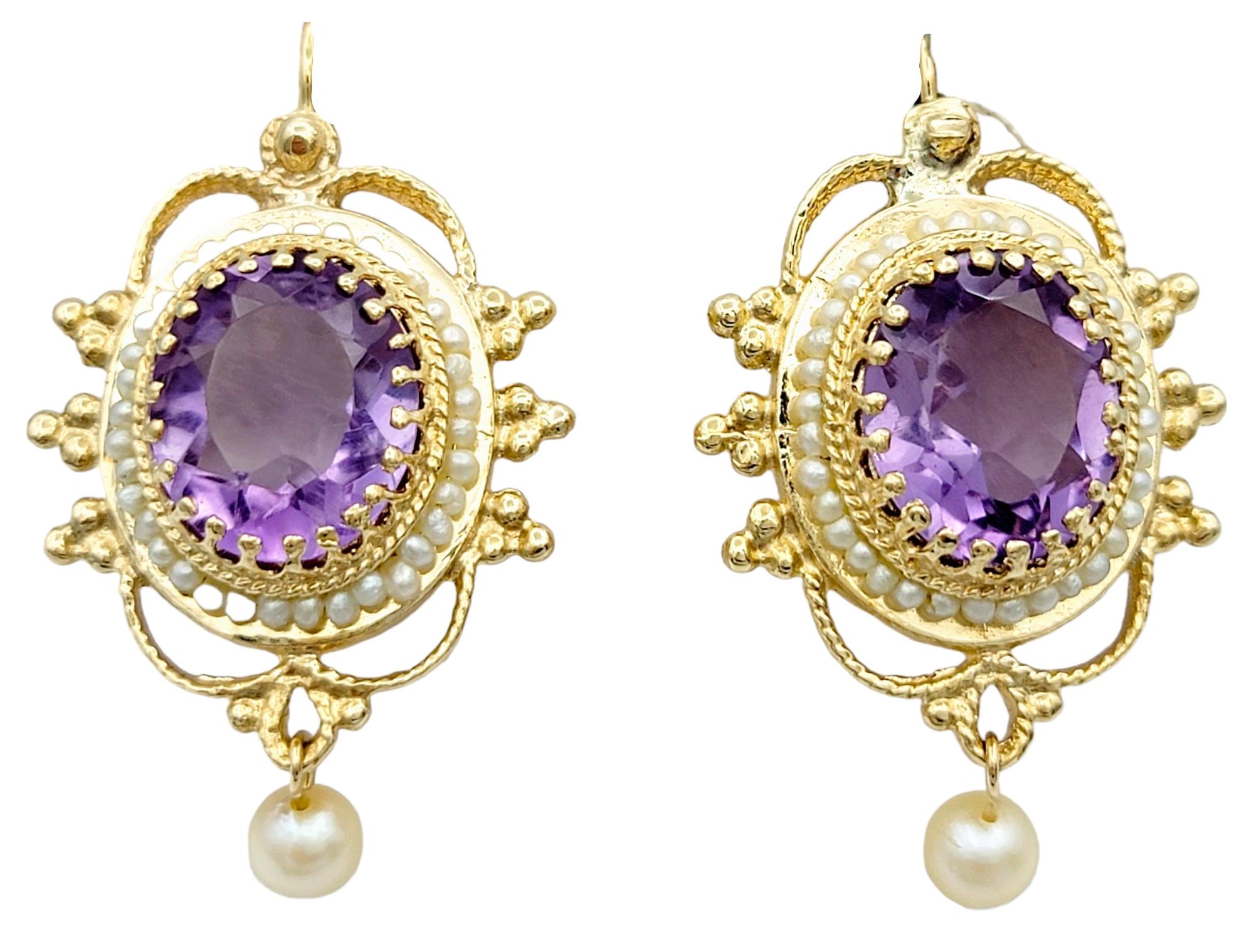 Contemporary Oval Amethyst and Seed Pearl Halo Dangle Earrings Set in 14 Karat Yellow Gold For Sale