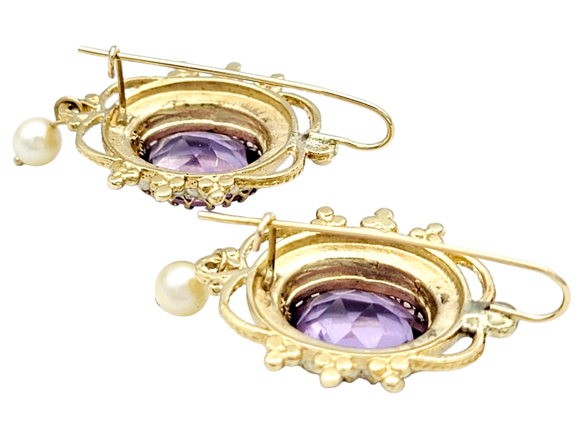 Oval Cut Oval Amethyst and Seed Pearl Halo Dangle Earrings Set in 14 Karat Yellow Gold For Sale