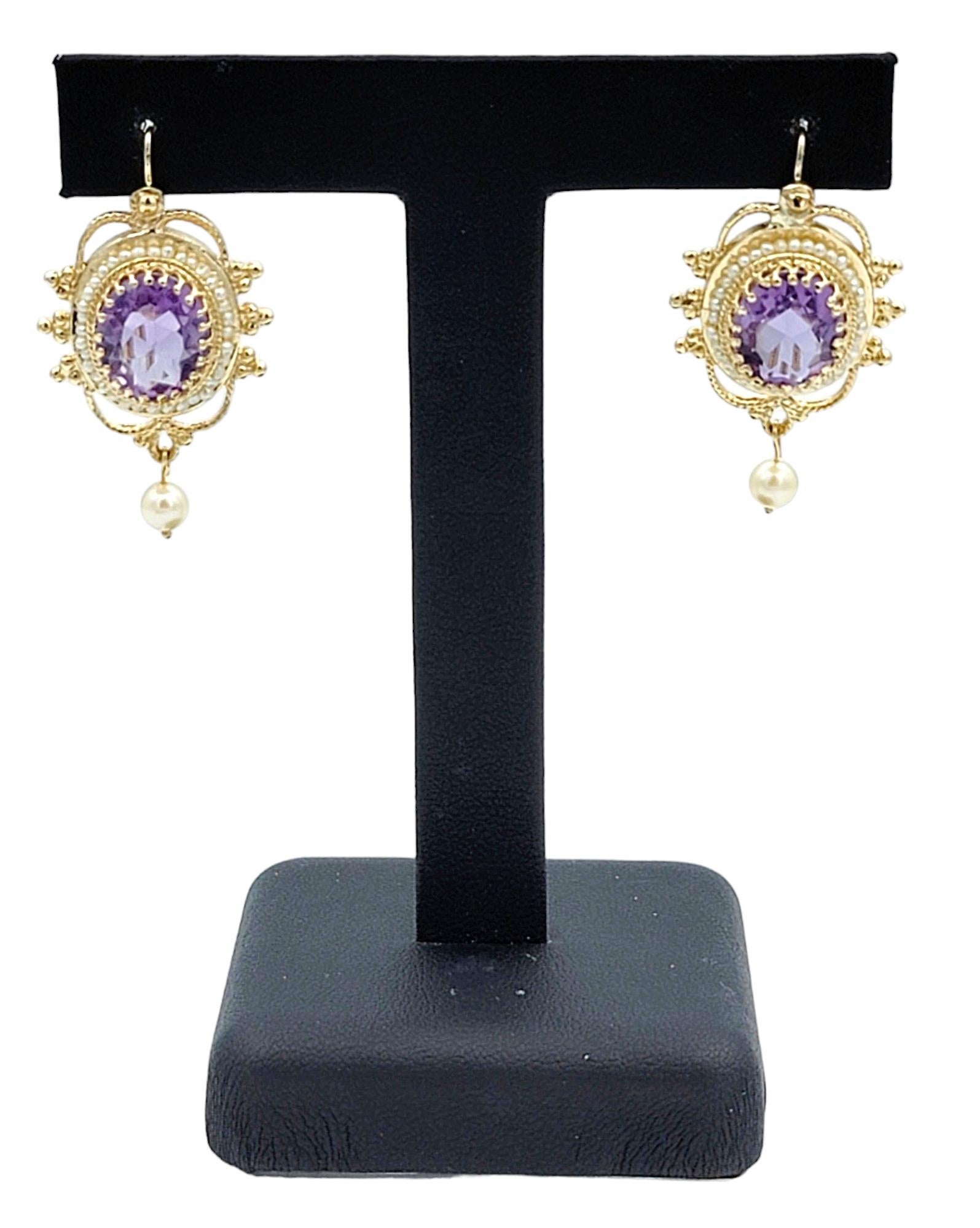 Oval Amethyst and Seed Pearl Halo Dangle Earrings Set in 14 Karat Yellow Gold For Sale 1