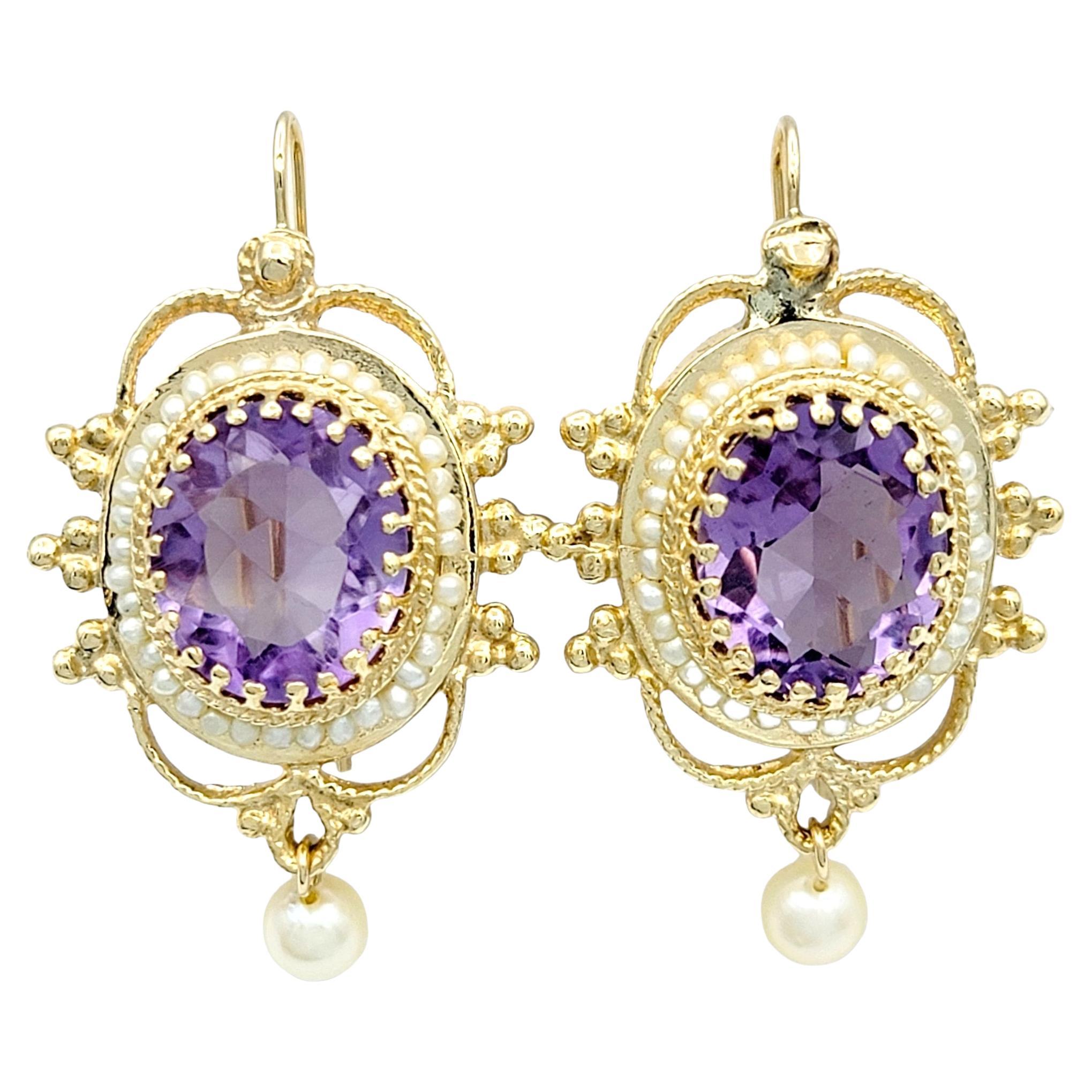 Oval Amethyst and Seed Pearl Halo Dangle Earrings Set in 14 Karat Yellow Gold For Sale