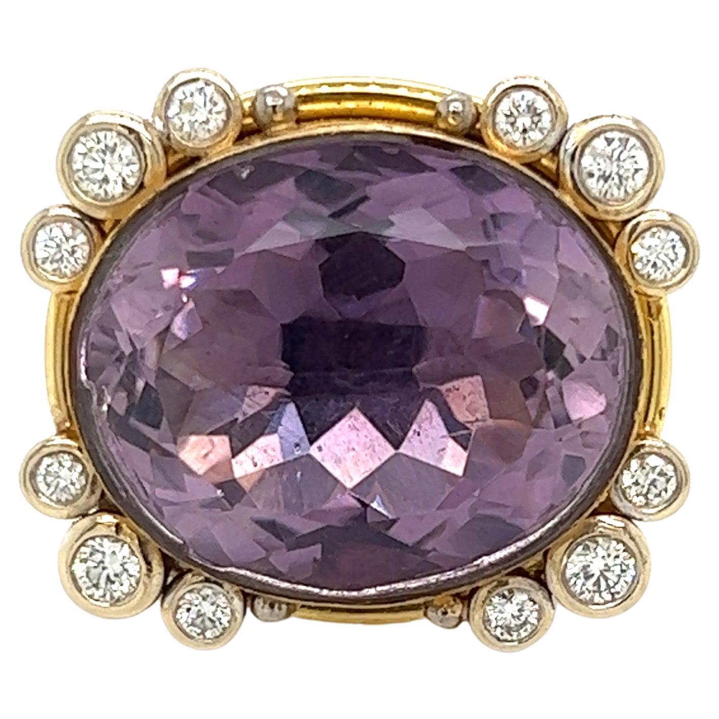 This exquisite custom made, one of a kind estate ring features a large, approximately 20 carat, oval amethyst. The amethyst is surrounded by 18 round diamonds totaling approximately 1.00 ctw, The diamonds are VS2 in clarity and H-I in color. 