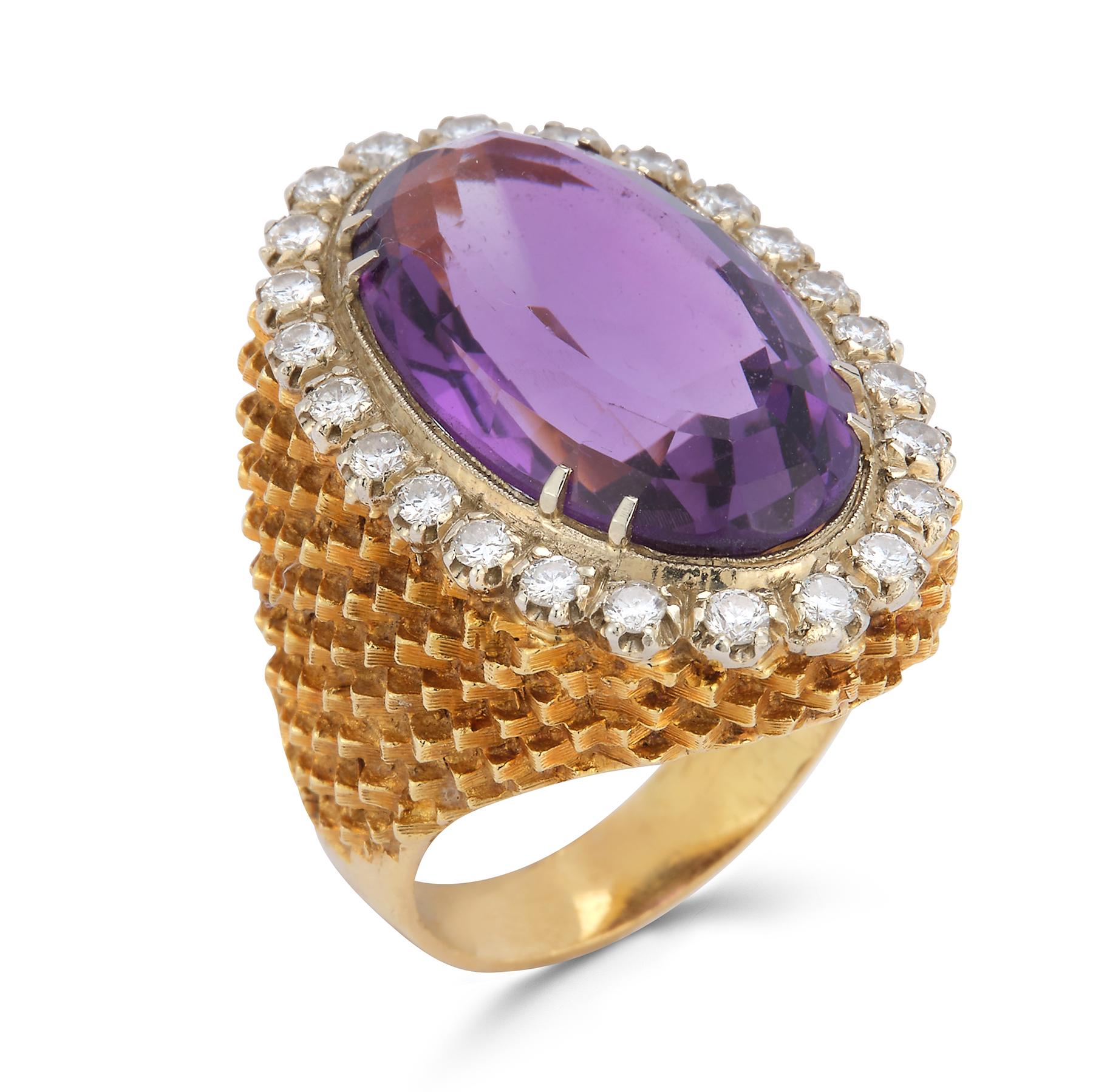 Oval Cut Amethyst & Diamond Cocktail Ring
1 oval cut center amethyst approximately 29.43 cts  
surrounded by round cut diamonds approximately 3.30 cts 

Set in 14k yellow gold.

Ring Size: 5