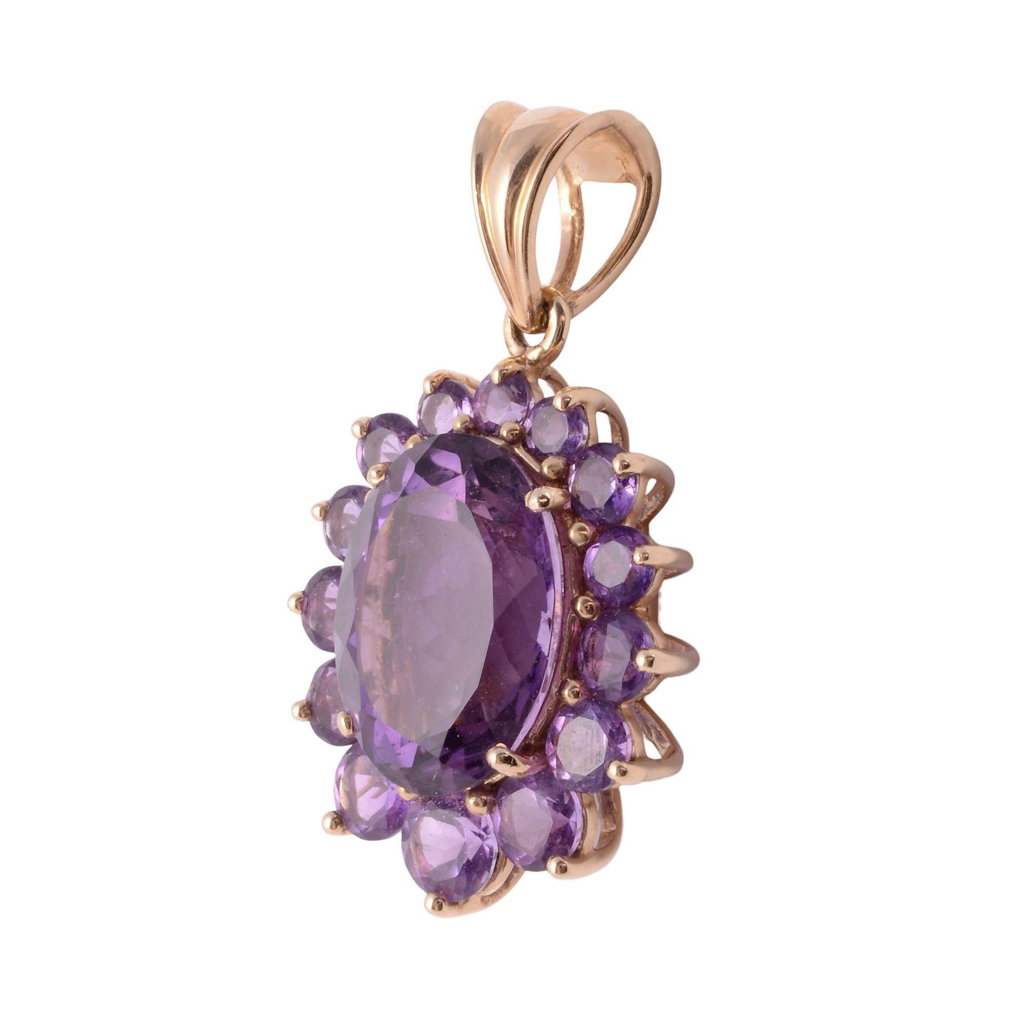 Estate oval amethyst pendant with amethyst surround. This 14 karat yellow gold pendant features a 9.0 carat center oval amethyst that is encircled with 2.30 CTW of round amethysts. [KIMH 537]

Dimensions
35.6mm H (including bale) x 20.5mm W