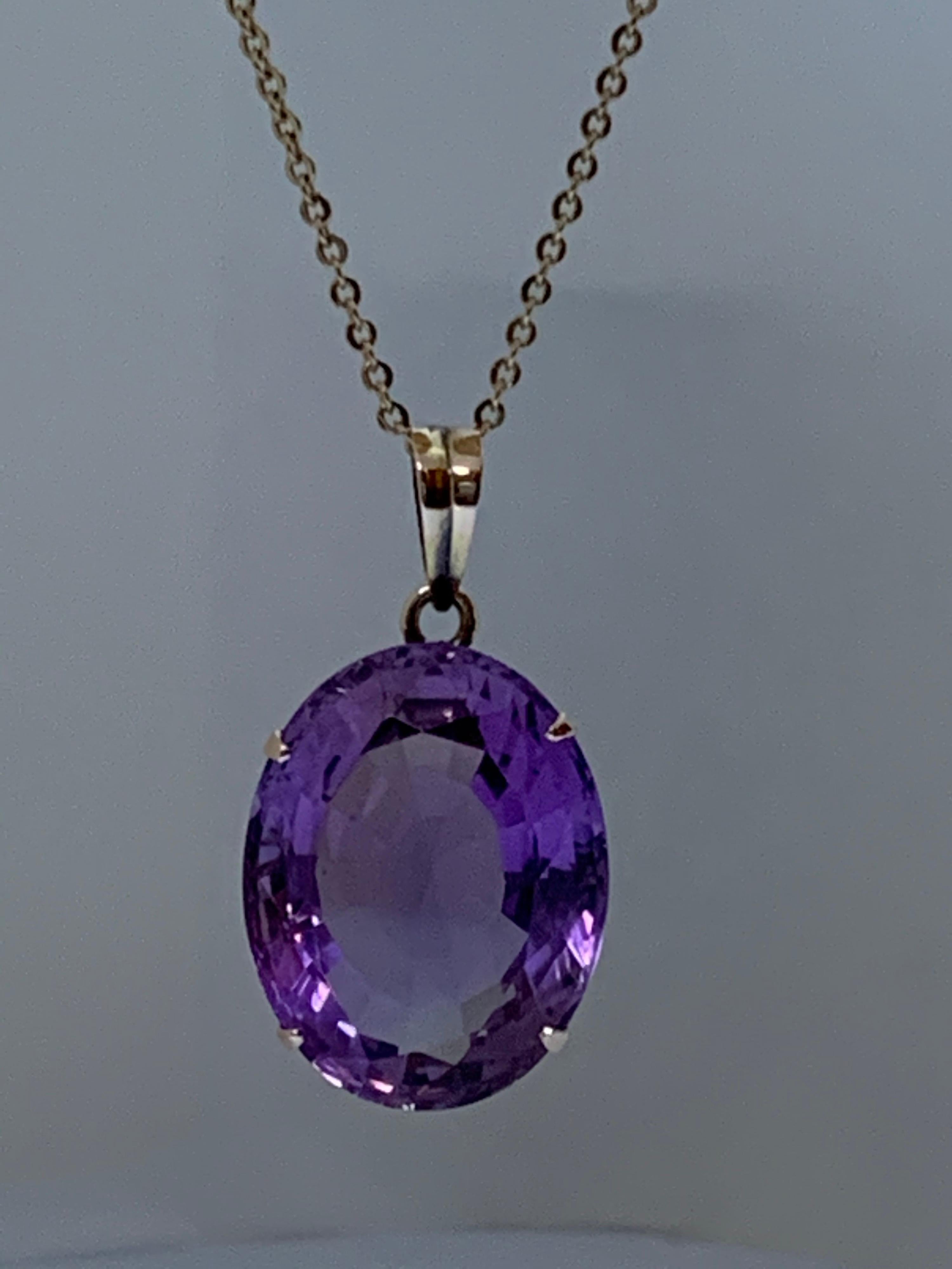 Contemporary Oval Amethyst Set in 14 Karat Gold Pendant For Sale