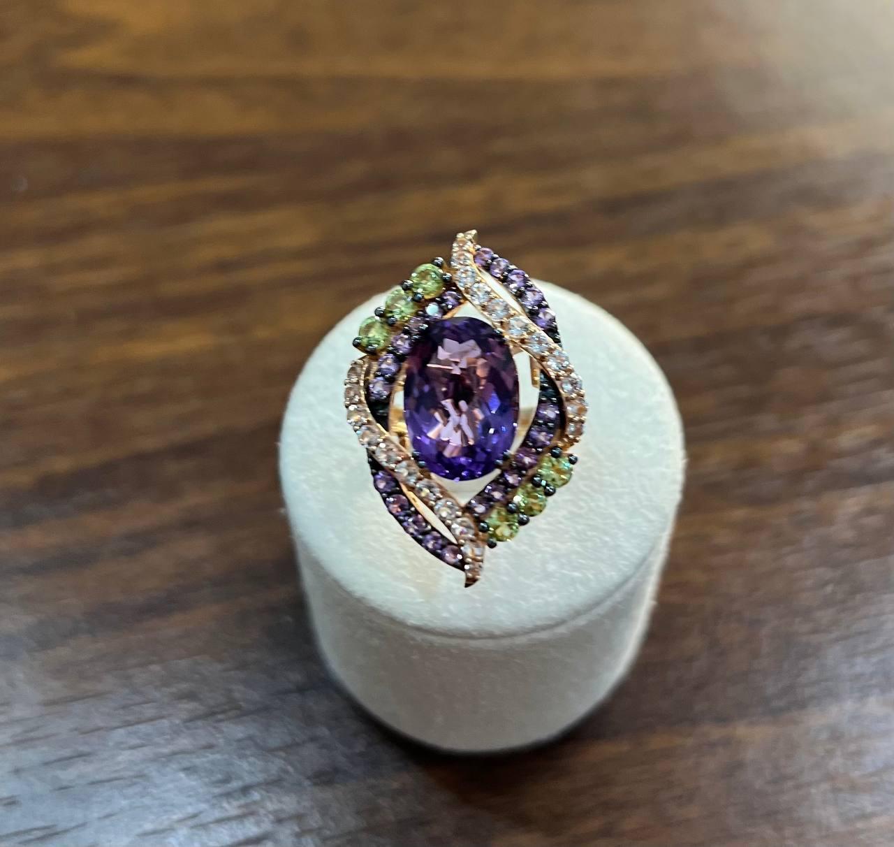 Elegant Amethyst and Diamond Pendant Necklace & Ring Set. This exquisite necklace features a stunning teardrop-shaped amethyst at its center, surrounded by a delicate arrangement of sparkling diamonds & gemstones. The pendant is set in a graceful