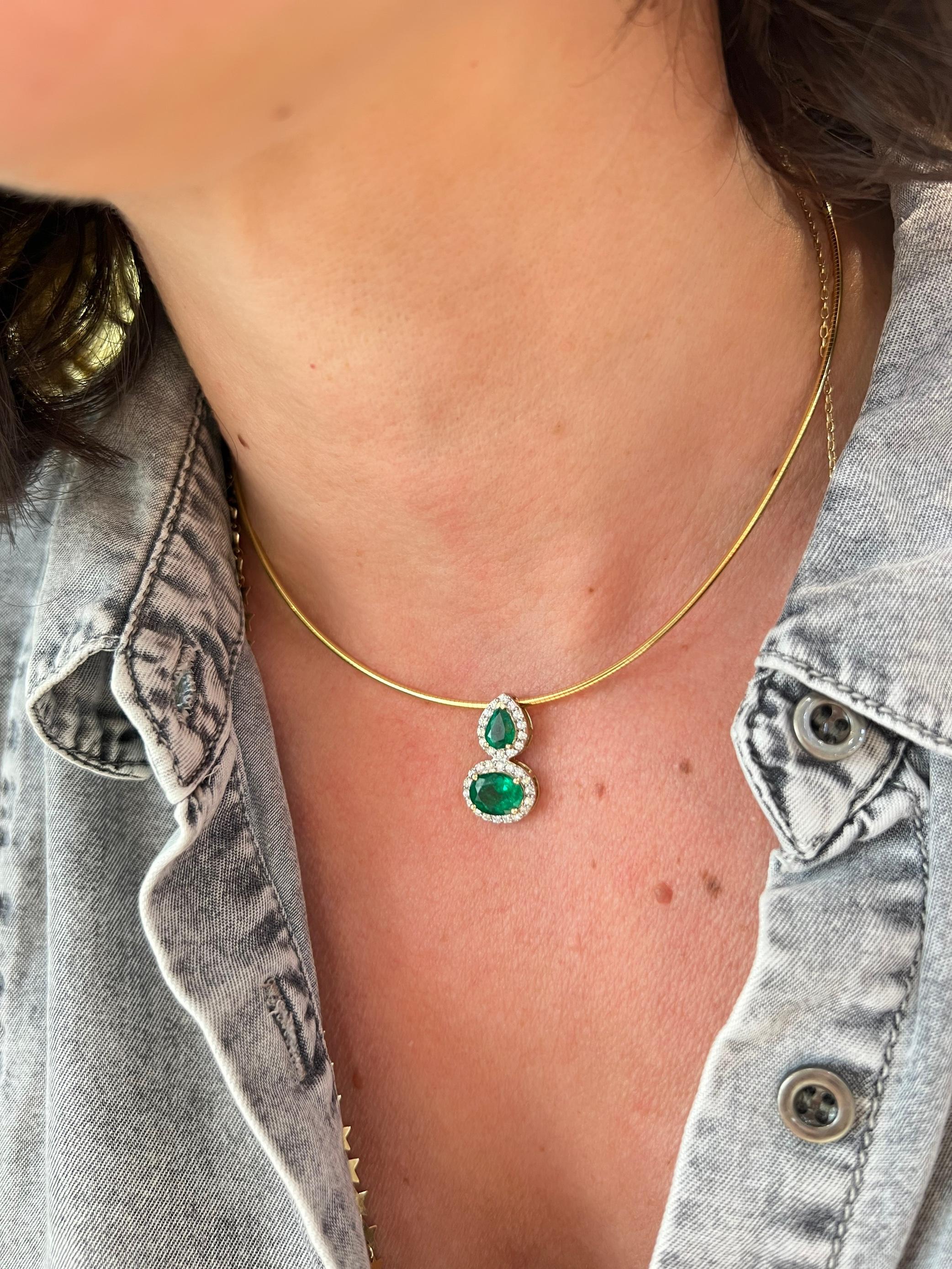14K yellow gold omega chain necklace with 2 stone emerald pendant.

Features

14k yellow gold
2.39 carat total weight emeralds.
The oval emerald measures approx. 9x7mm
the pear shape emerald measures  approx. 7x 5 mm
.16 carat total weight in