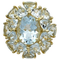 Oval and Trillion Cut Aquamarine Cluster Cocktail Ring in 14 Karat Yellow Gold