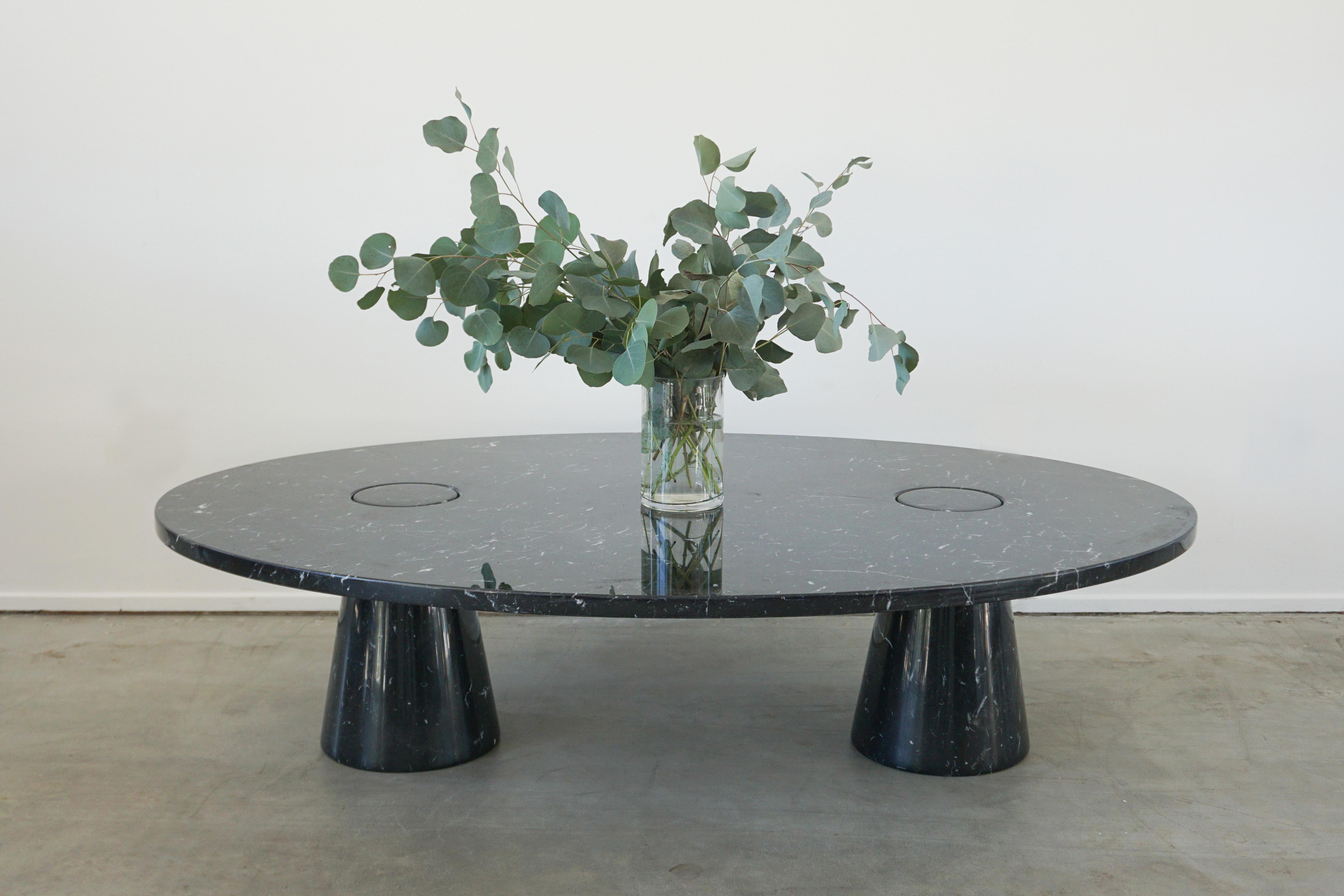 Impressively large scale oval shaped coffee table by Angelo Mangiarotti for Eros 
Black Marquina marble with 2 column legs and floating top 
Incredible and rare piece. 

Measures: 43 x 62 x 16.
