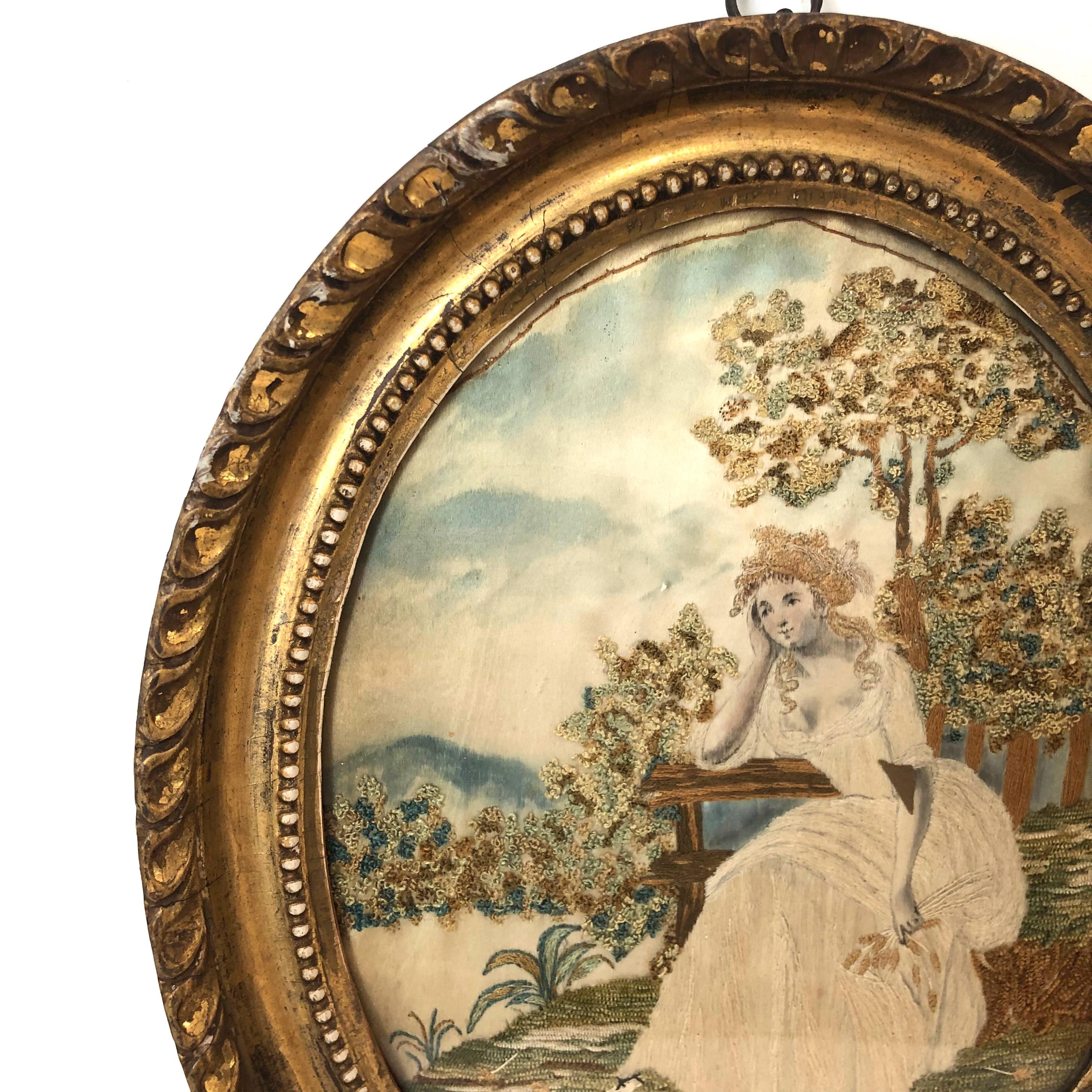 First quarter of the 19th century oval antique framed silk embroidery of sitting woman,
circa 1800-1820. Original frame.