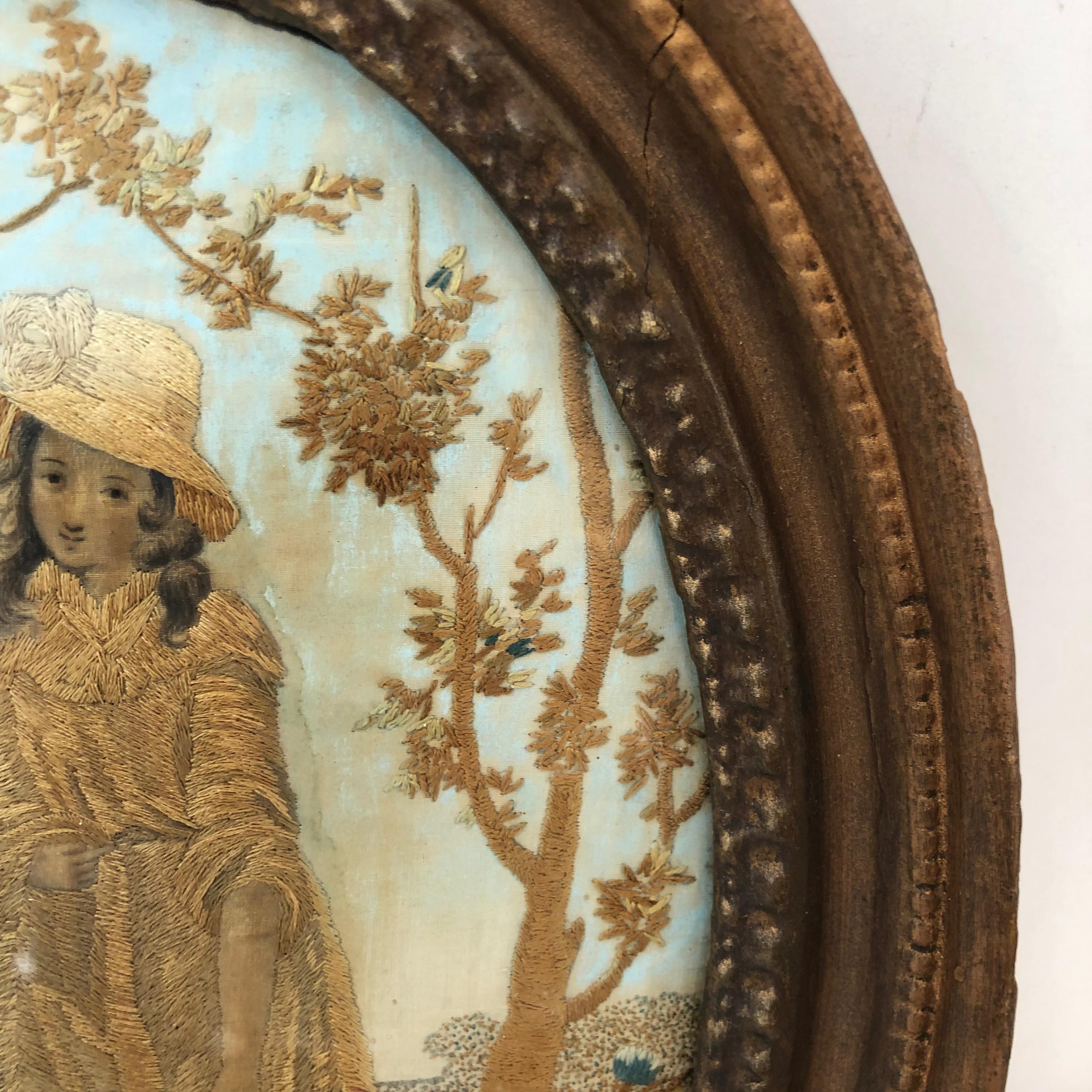 First quarter of the 19th century oval antique framed silk embroidery of woman in white hat,
circa 1800-1820. Original frame.