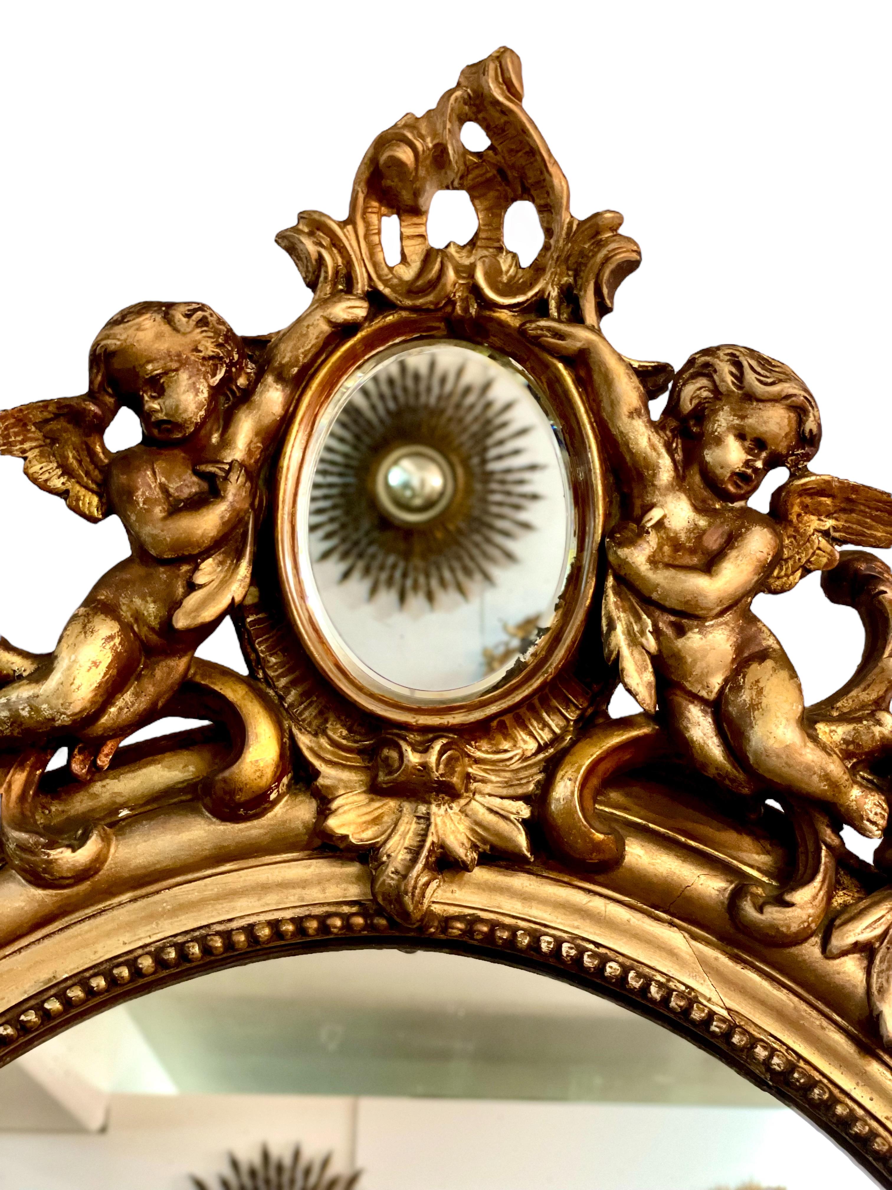 Napoleon III French Antique Oval Giltwood Mirror with Cherubs For Sale