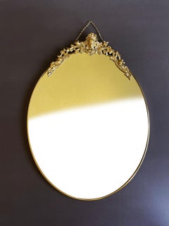 Oval Antique Rococo Style Brass Mirror Ornamental Putto, 1960s Italy