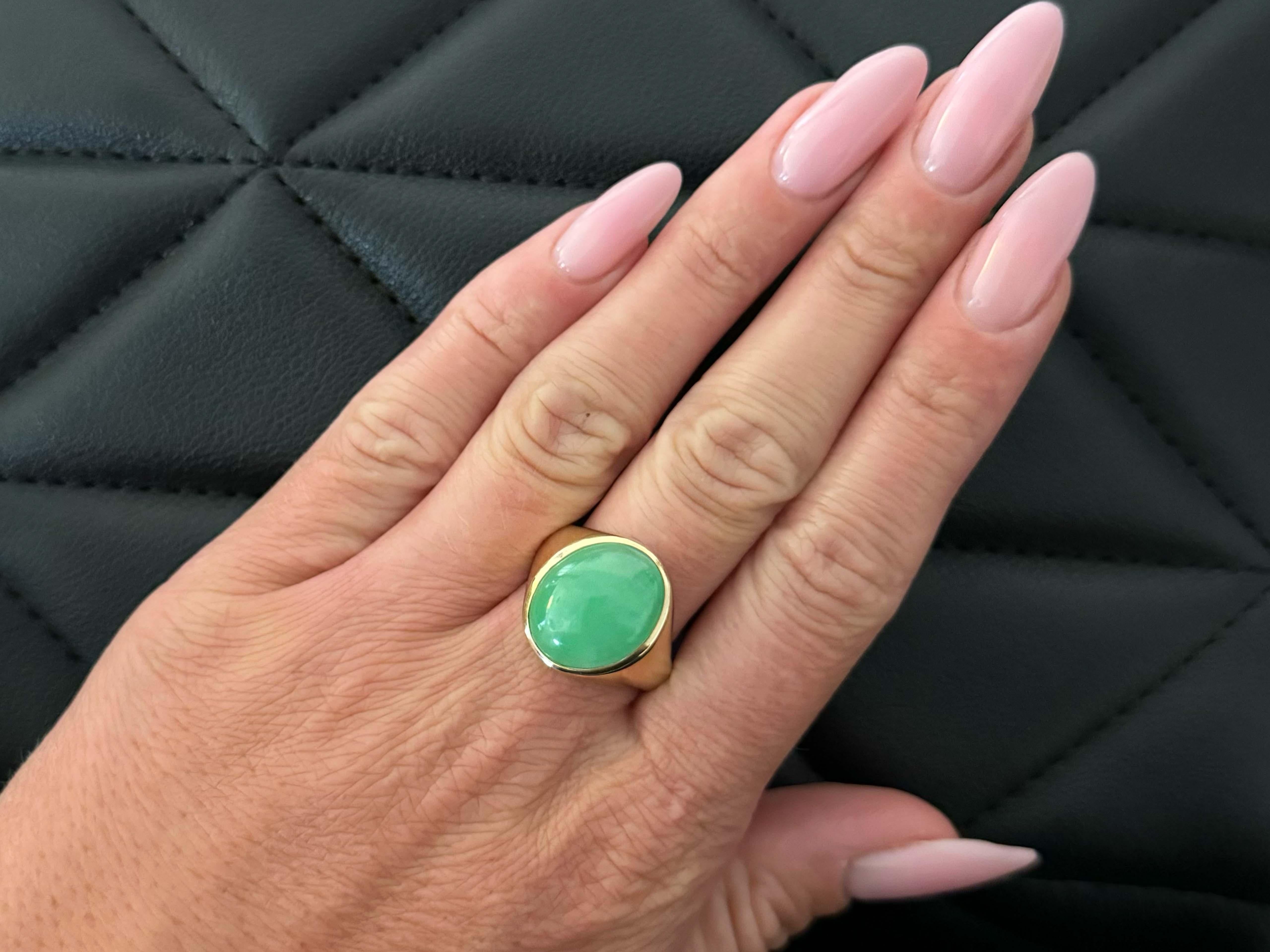 Item Specifications:

Metal: 14k Yellow Gold 

Style: Statement Ring

Ring Size: 11.25 (resizing available for a fee)

Total Weight: 8.7 Grams

Gemstone Specifications:

Center Gemstone: Jadeite Jade

Shape: Oval

Color: Apple Green

Jade