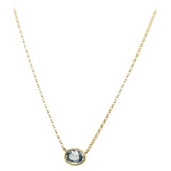 Pendentif aigue-marine ovale 0,75 carat sur chaîne en or jaune 18 carats