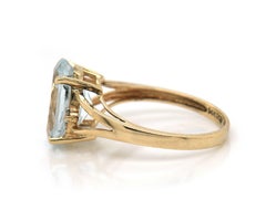 Oval Aquamarine and 0.04ctw Diamond Split Shank Ring in 14K Yellow Gold