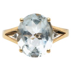 Ovaler Aquamarin und 0,04 Karat Diamant-Ring mit geteiltem Schaft aus 14 Karat Gelbgold
