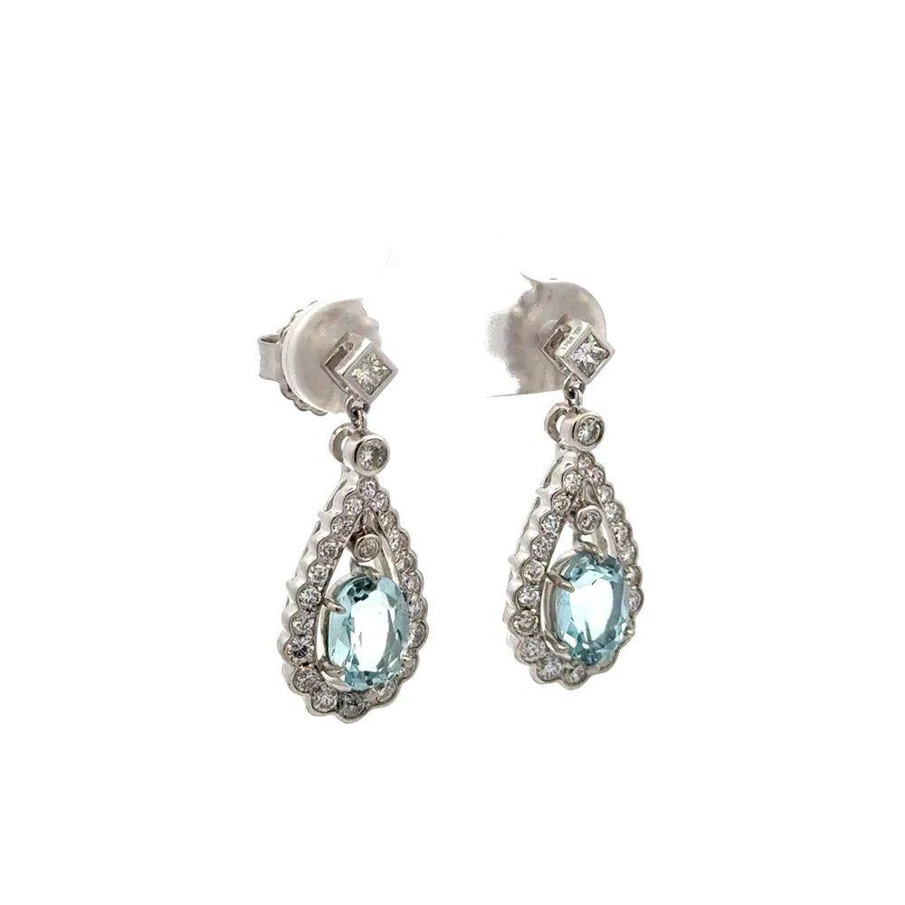 Oval Aquamarine and RBC Diamond Platinum Statement Drop Earrings Simply Beautiful! Finely detailed Oscar Worthy Aquamarine and Round Brilliant Cut Diamond Platinum Drop Earrings. Each earring Hand set with an Oval Aquamarine, weighing approx.