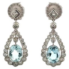 Boucles d'oreilles pendantes en platine avec aigue-marine ovale et diamant RBC