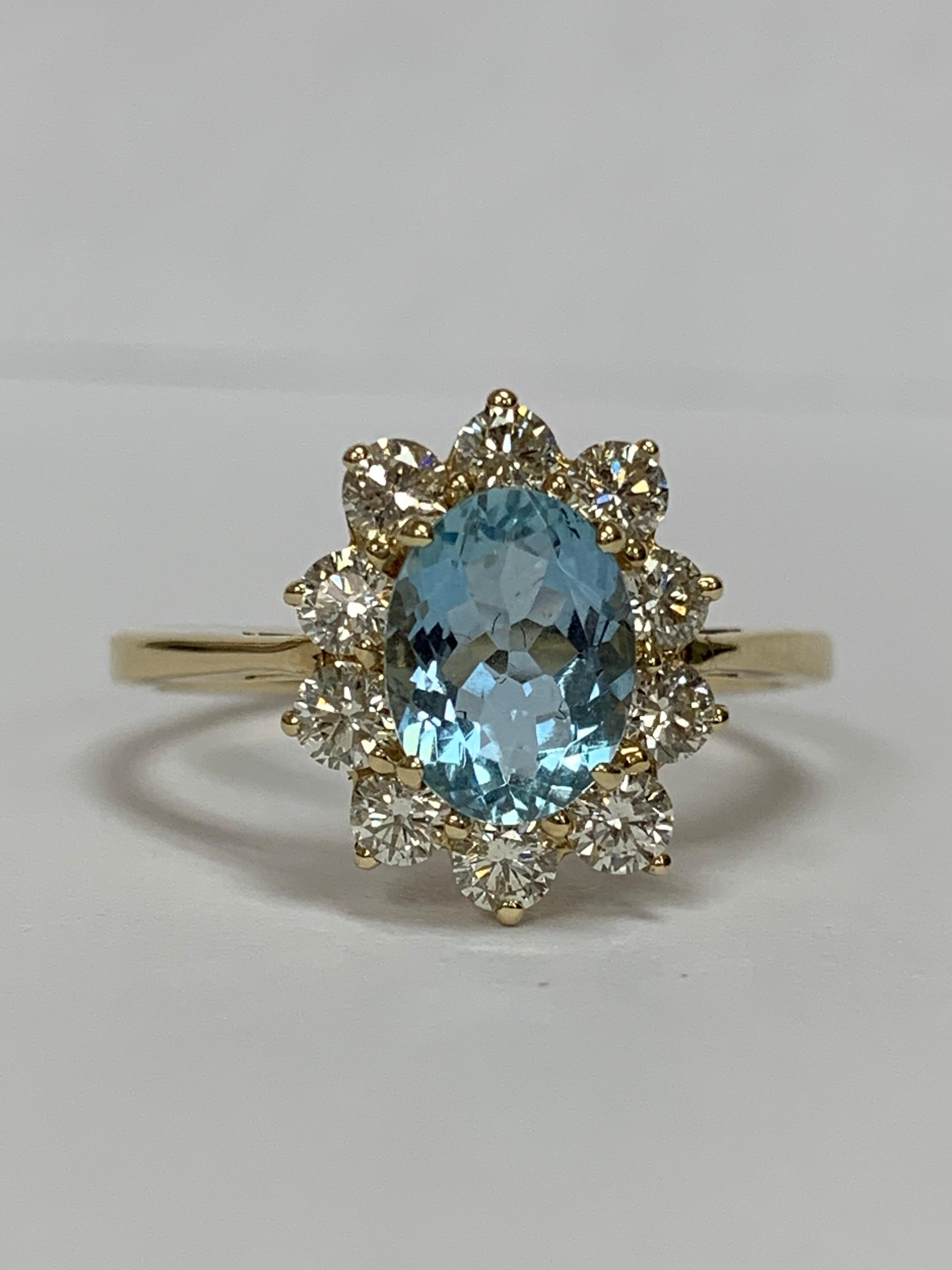 Oval Aquamarine and White Round Diamond Ring Set in 14 Karat Yellow Gold 1