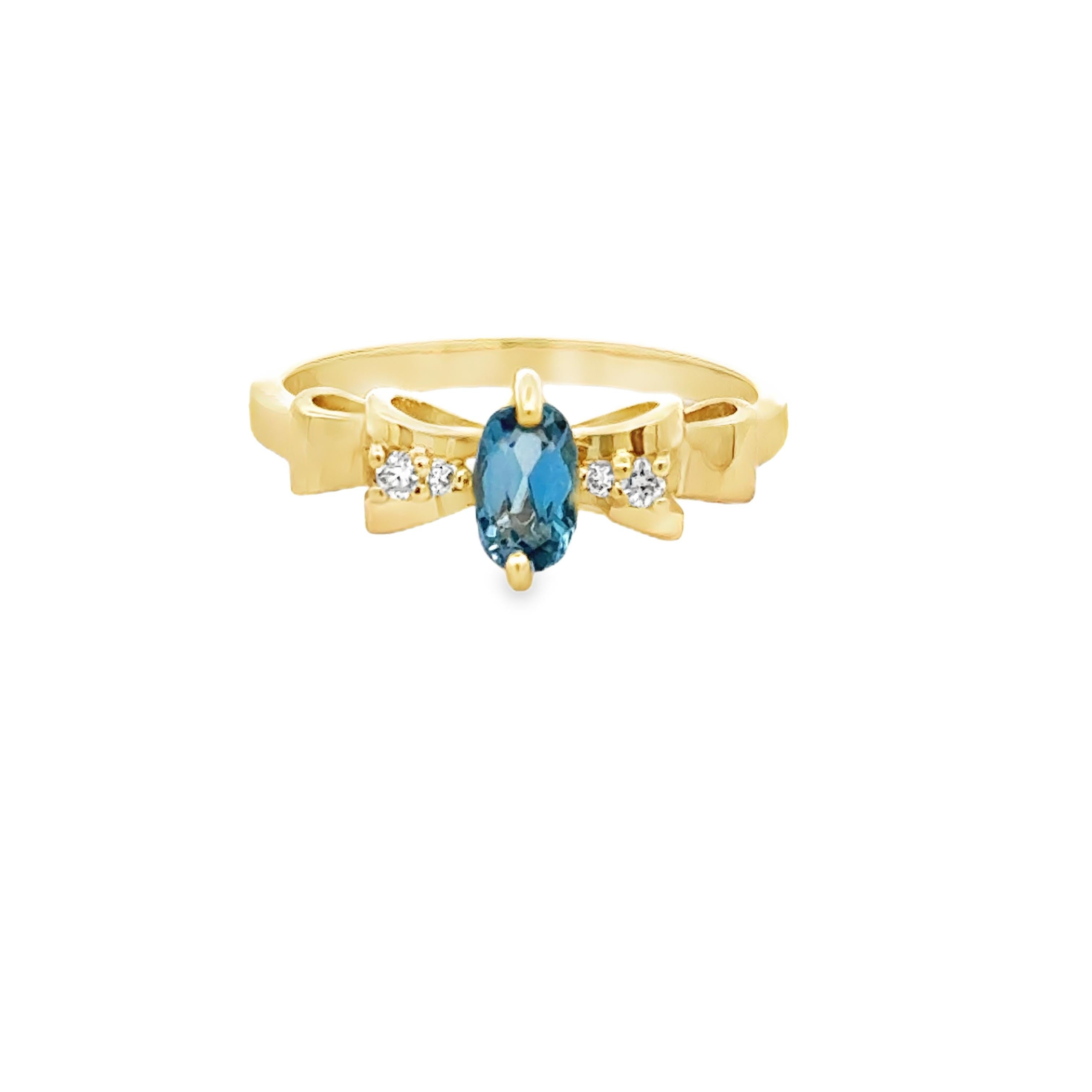 This elegant ring features a bow motif, adding a delicate touch to the oval aquamarine and diamond accents. Crafted in 14K yellow gold, this ring is a timeless and classic addition to any jewelry collection. Elevate your look with the subtle charm