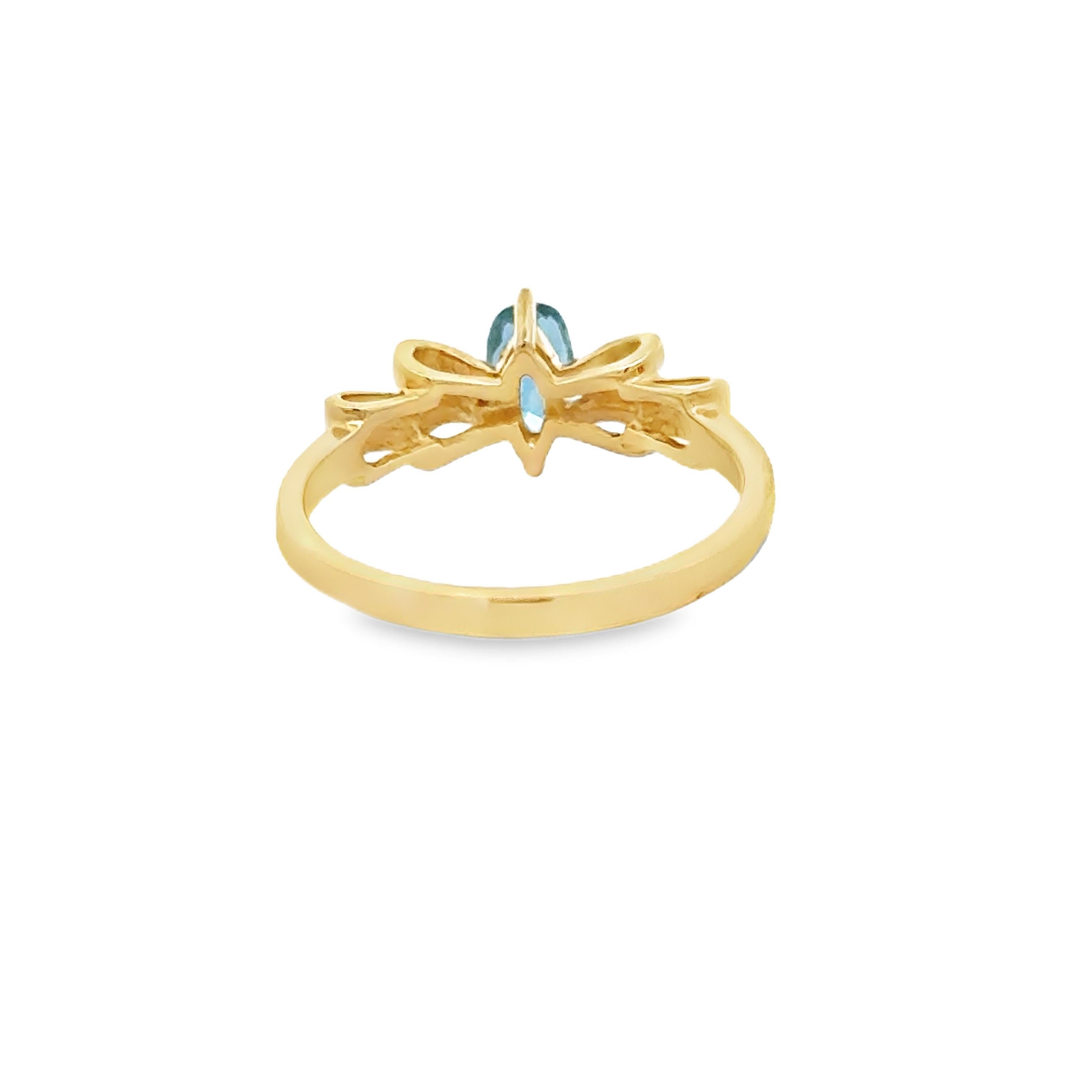 Oval Cut Oval Aquamarine, Diamond and 14K Yellow Gold Bow Ring For Sale
