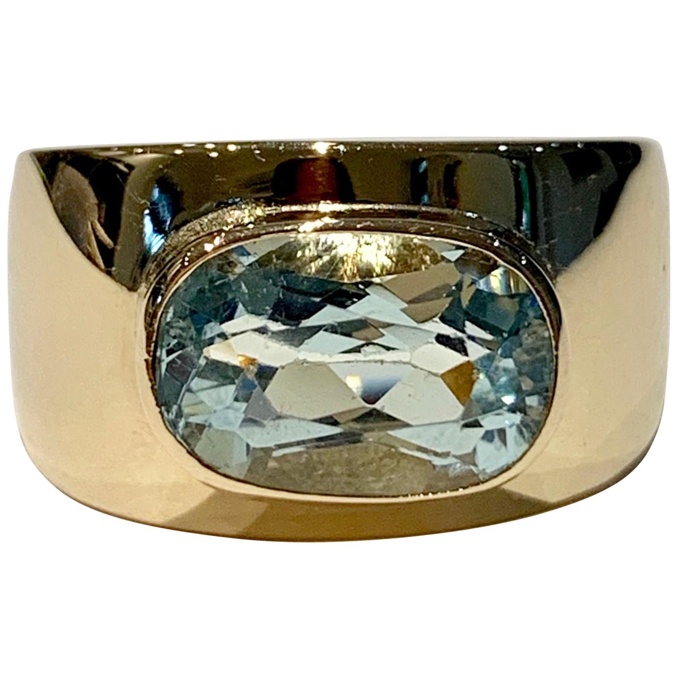 Oval Aquamarine in Wide 9 Carat Yellow Gold Band For Sale
