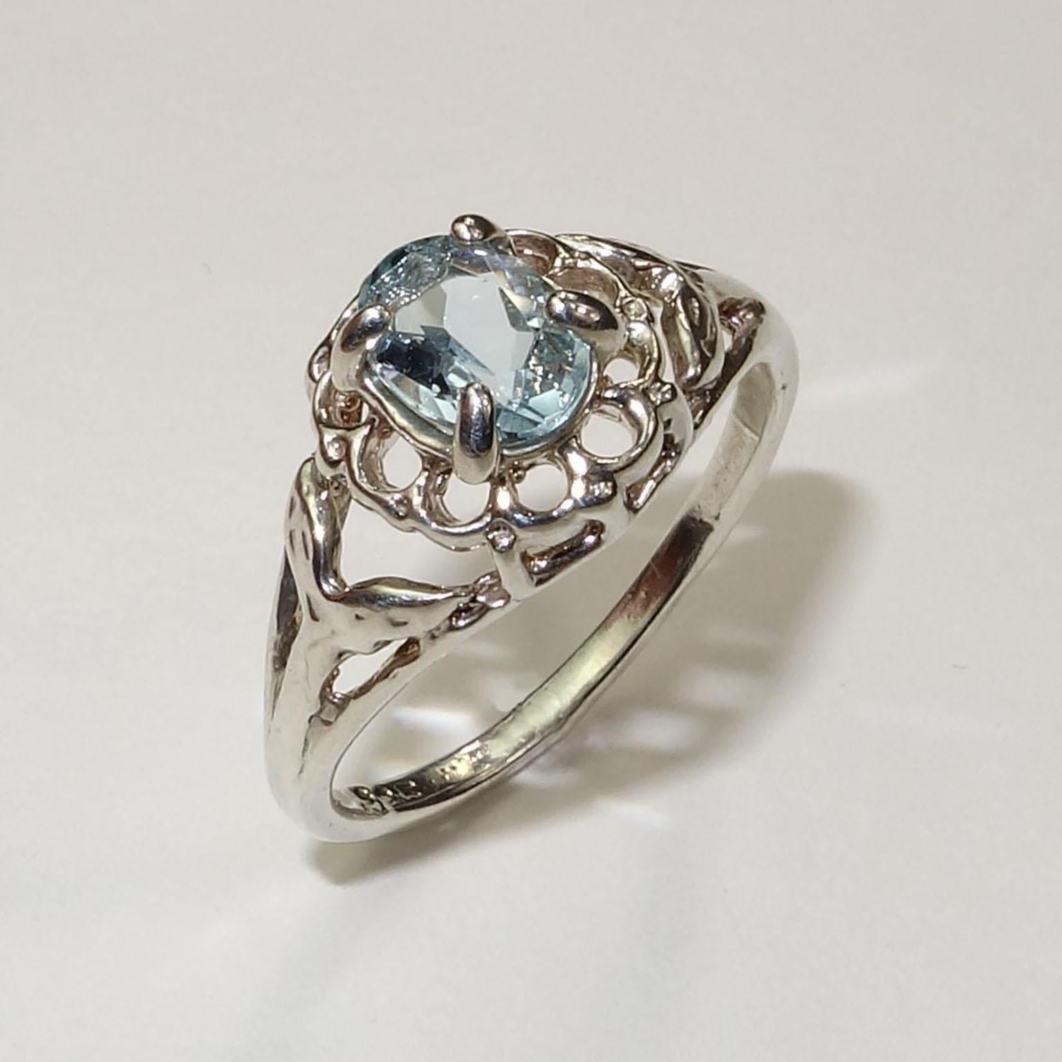 Custom made, Beautiful Blue oval Aquamarine set in Sterling Silver ring. . Delicate blue Aquamarine matches the unique filigree of the ring.  Remember that Aquamarine is  the March birthstone.  Sizable by your jeweler, 6.5. To see more from this