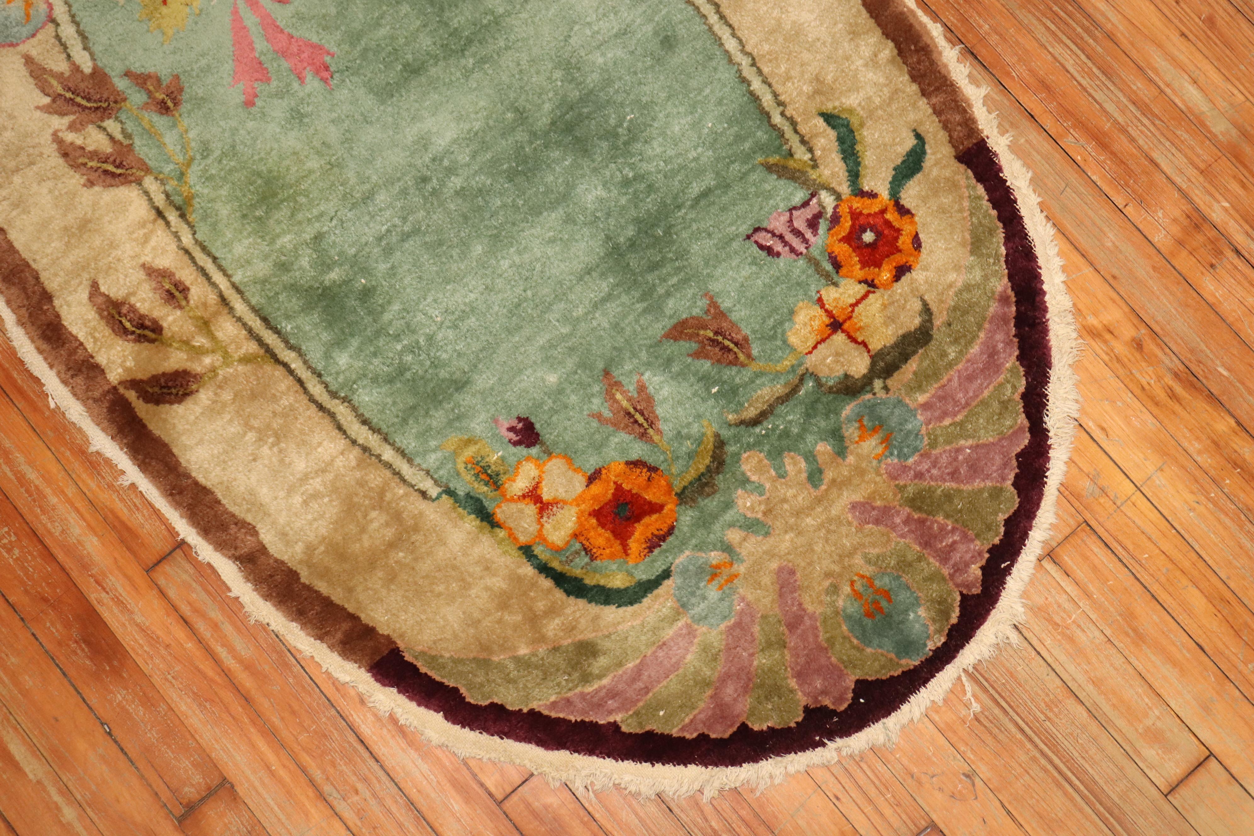 Rare oval shaped Chinese Art Deco rug.

3' x 4'10''

Chinese Art Deco rugs are known for their striking mix of asymmetrical patterns, vibrant colors, and traditional motifs, which are is bold, beautiful, and quite rare. Woven between World War I and