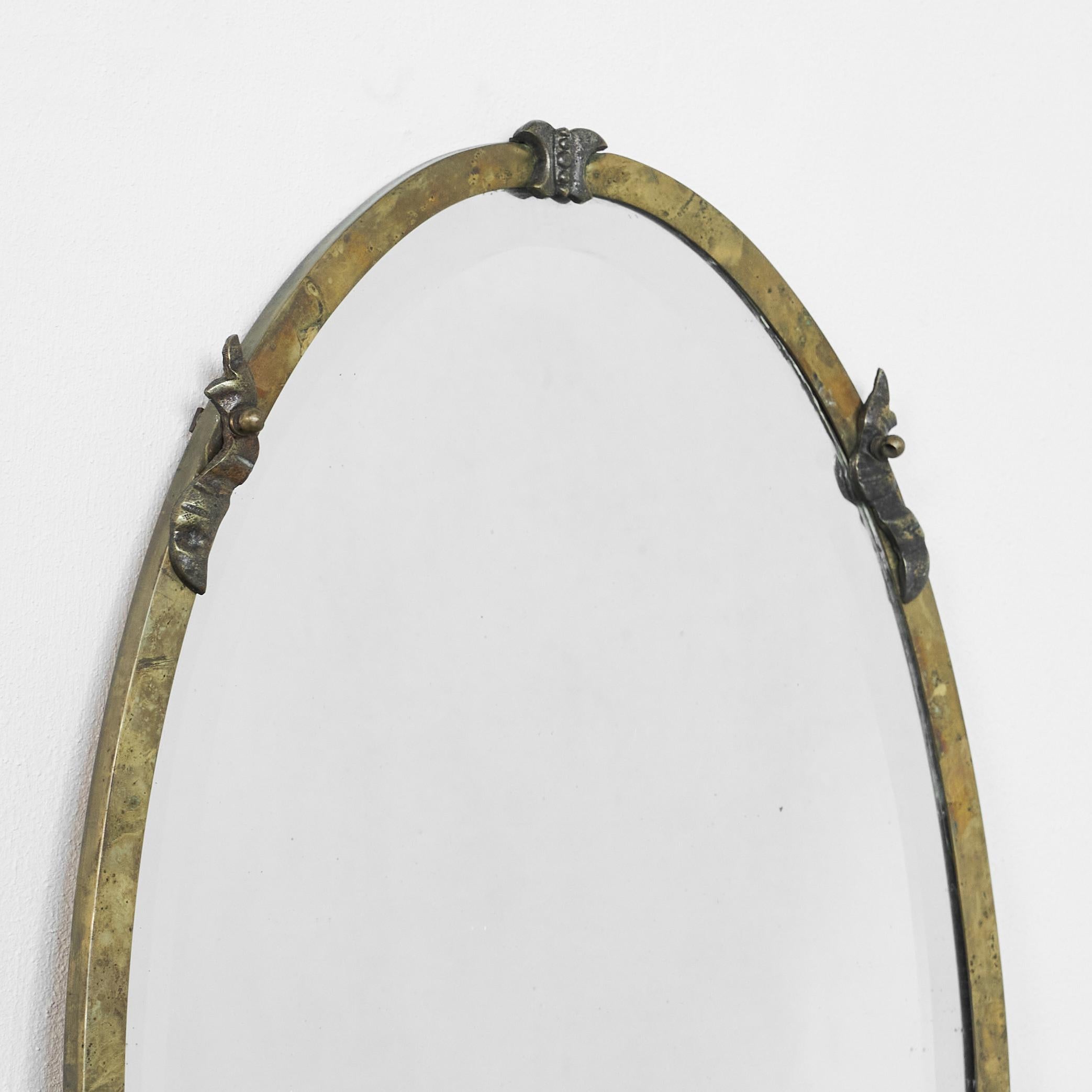 European Oval Art Deco Mirror in Patinated Brass and Beveled Glass 1930s