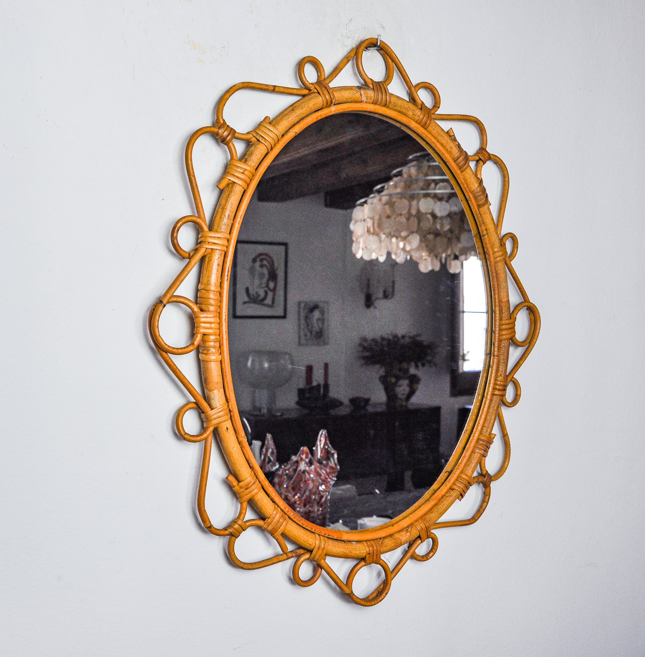 Superb and rare oval bamboo mirror produced in Italy in the 1970s. Very well preserved. Unique object that will decorate and bring a real design touch to your interior. Ref: 1251.
