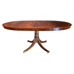 Oval Banded Mahogany Single Pedestal Dining Table with One Leaf