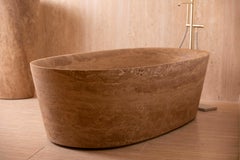 "Oval Banheira" bathtub made of Almond Travertine