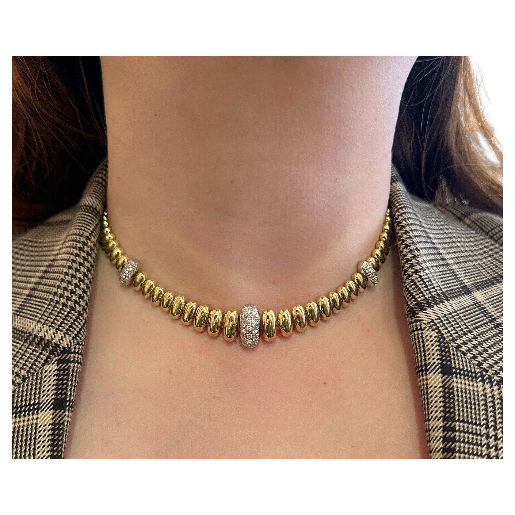 Oval Bead Link Choker Necklace with Diamond Links in 18k Yellow Gold

18k Yellow Gold Oval Bead Choker features elongated Oval-shaped Gold beads graduating in size, with three beads set with Pavé Diamonds in 18k Yellow Gold.

Total diamond weight 