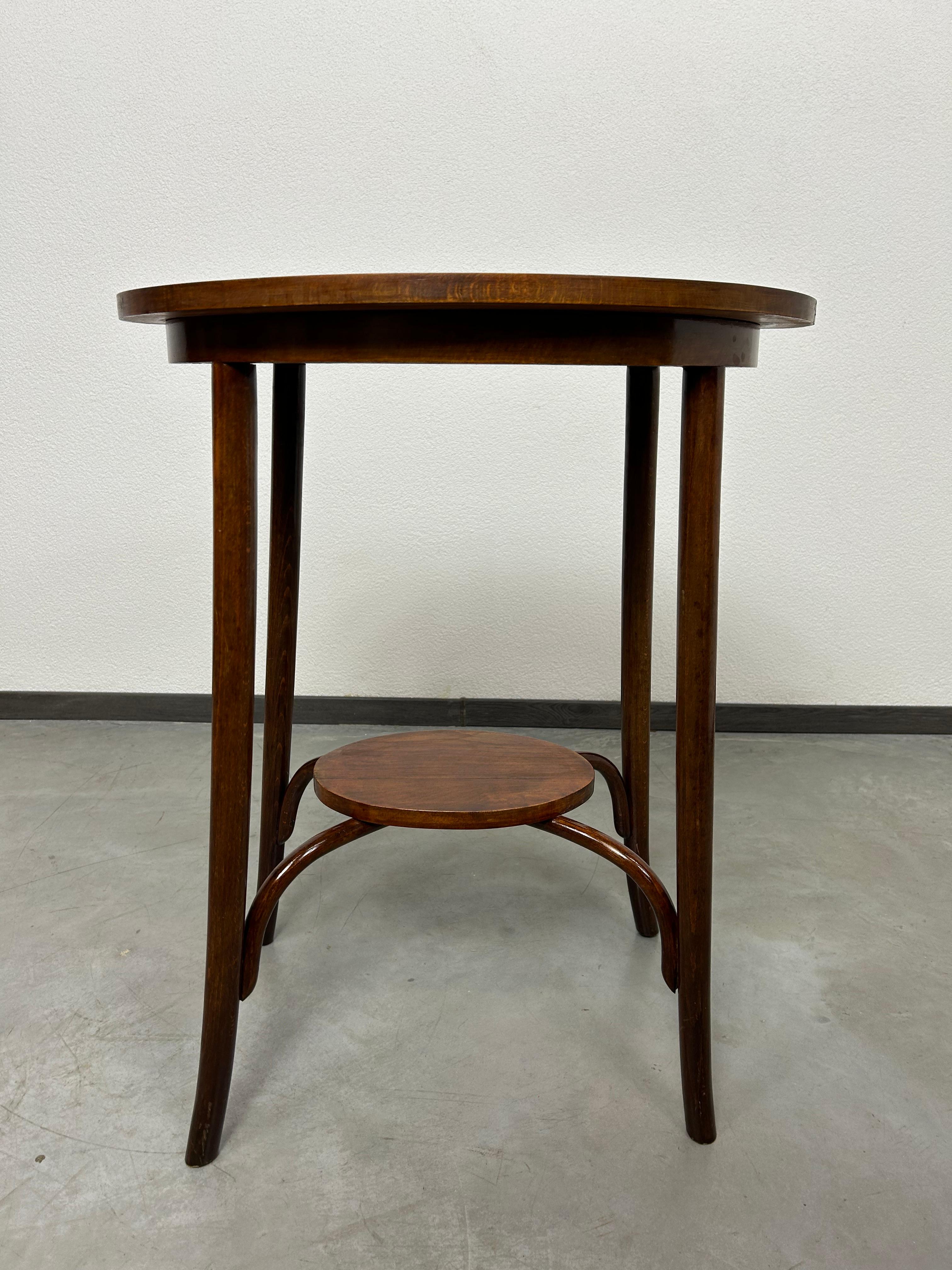Oval bentwood table by Thonet in very good original condition.